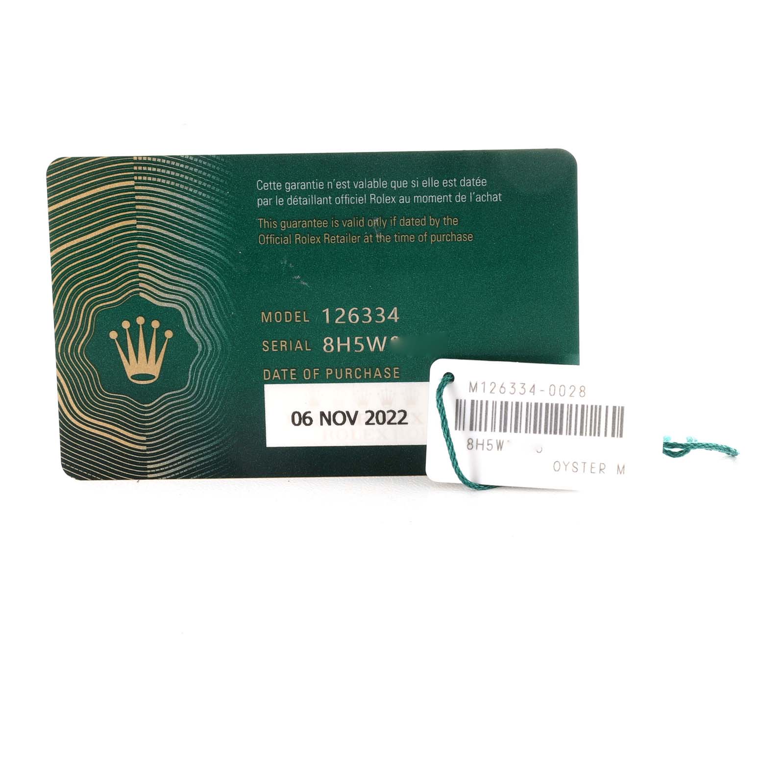 The image shows a warranty card and a tag for the Rolex Datejust 41 126334 Men
s Stainless Steel Green Dial 126334 Men
s Stainless Steel Green Dial model.