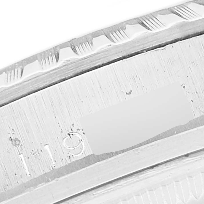 The image shows a close-up of the engraving and edge of a watch bezel from the Rolex Vintage Collection 1603 Men
s Stainless Steel Black Dial 1603 Men
s Stainless Steel Black Dial model.