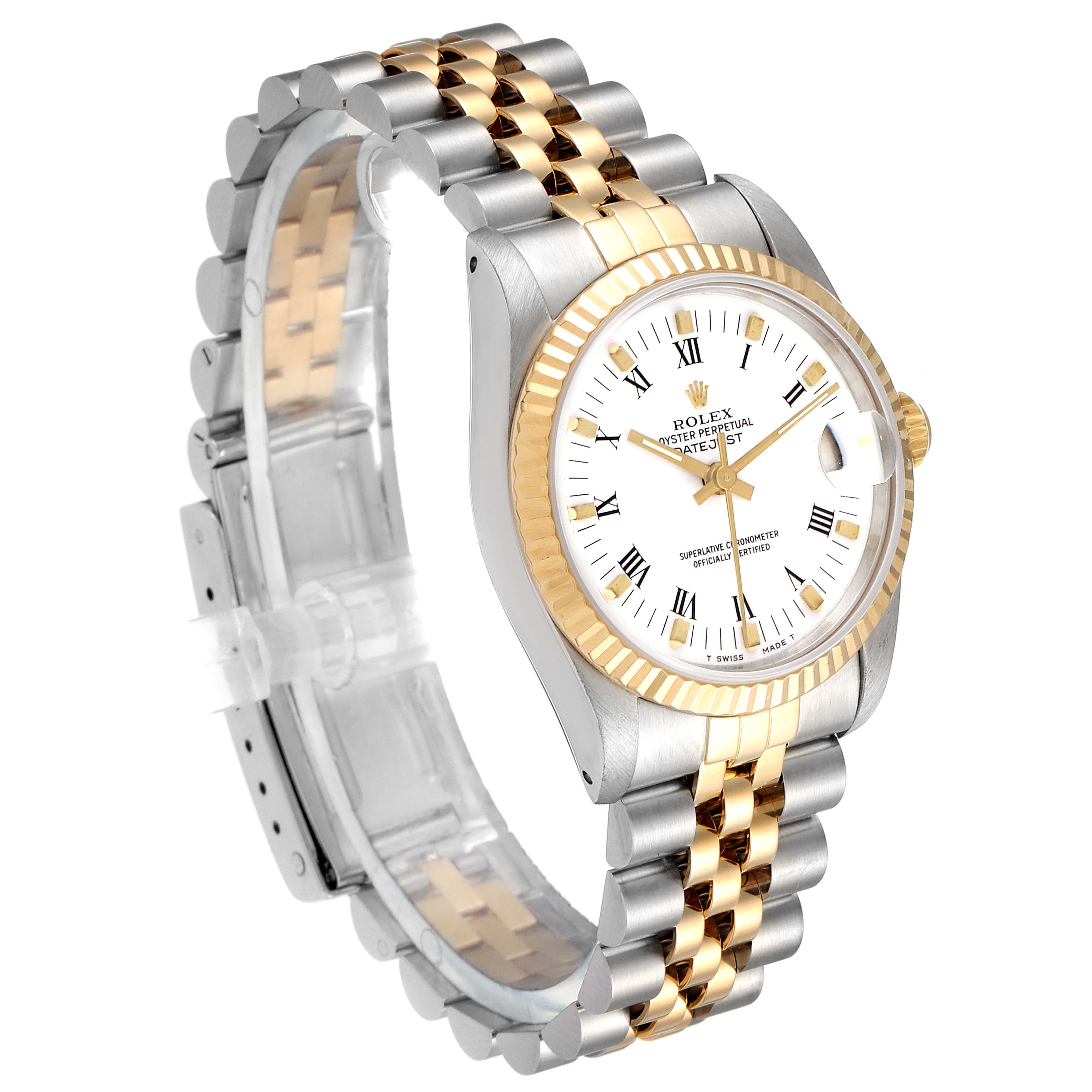 The image shows a Rolex Mid-Size 68273 Women
s Steel and Gold (two tone) White Dial 68273 Women
s Steel and Gold (two tone) White Dial Oyster Perpetual Datejust watch from an angled side view, highlighting its two-tone bracelet and white dial.