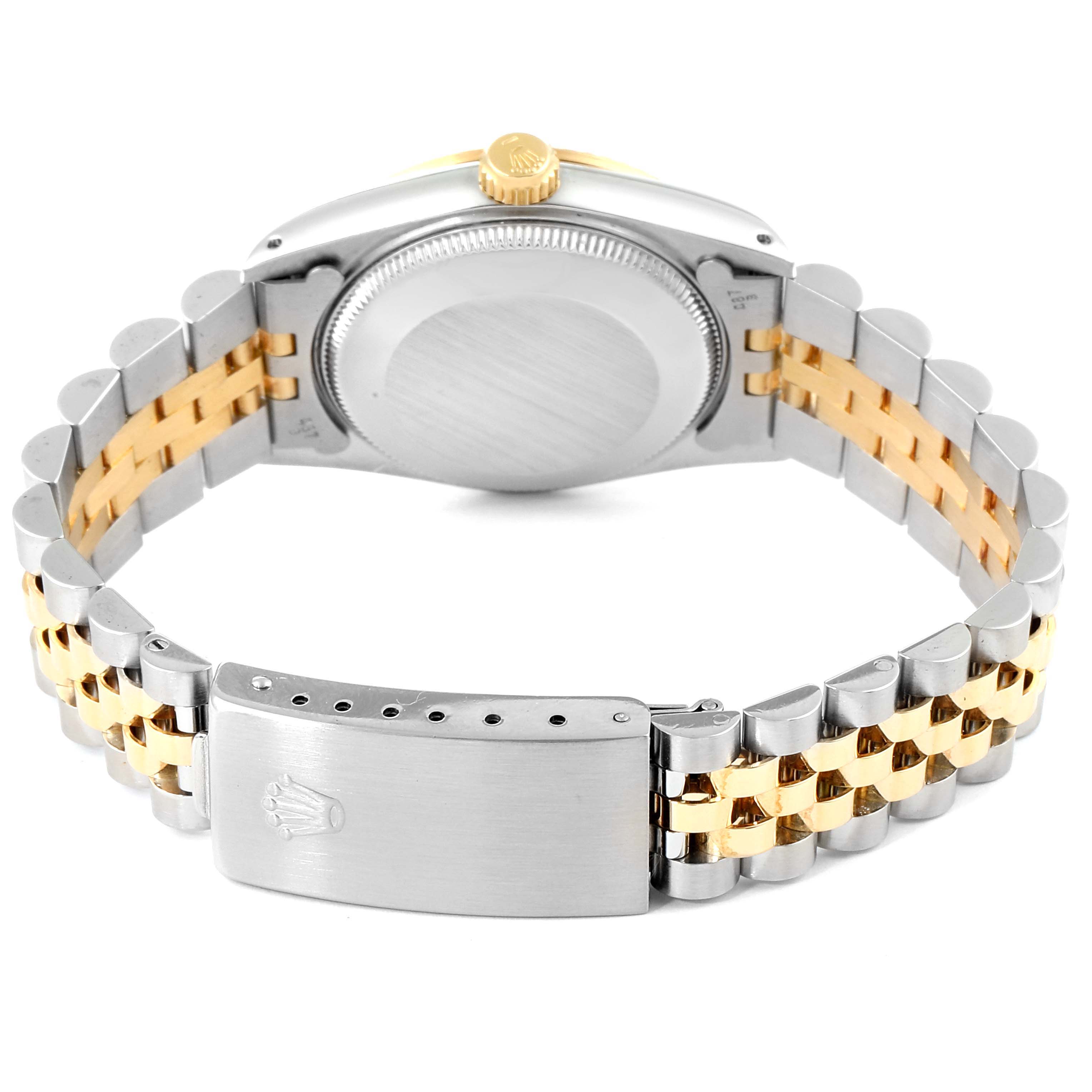 The image shows the back view of a Rolex Mid-Size 68273 Women
s Steel and Gold (two tone) Champagne Dial 68273 Women
s Steel and Gold (two tone) Champagne Dial watch, highlighting the clasp, case back, and two-tone bracelet.