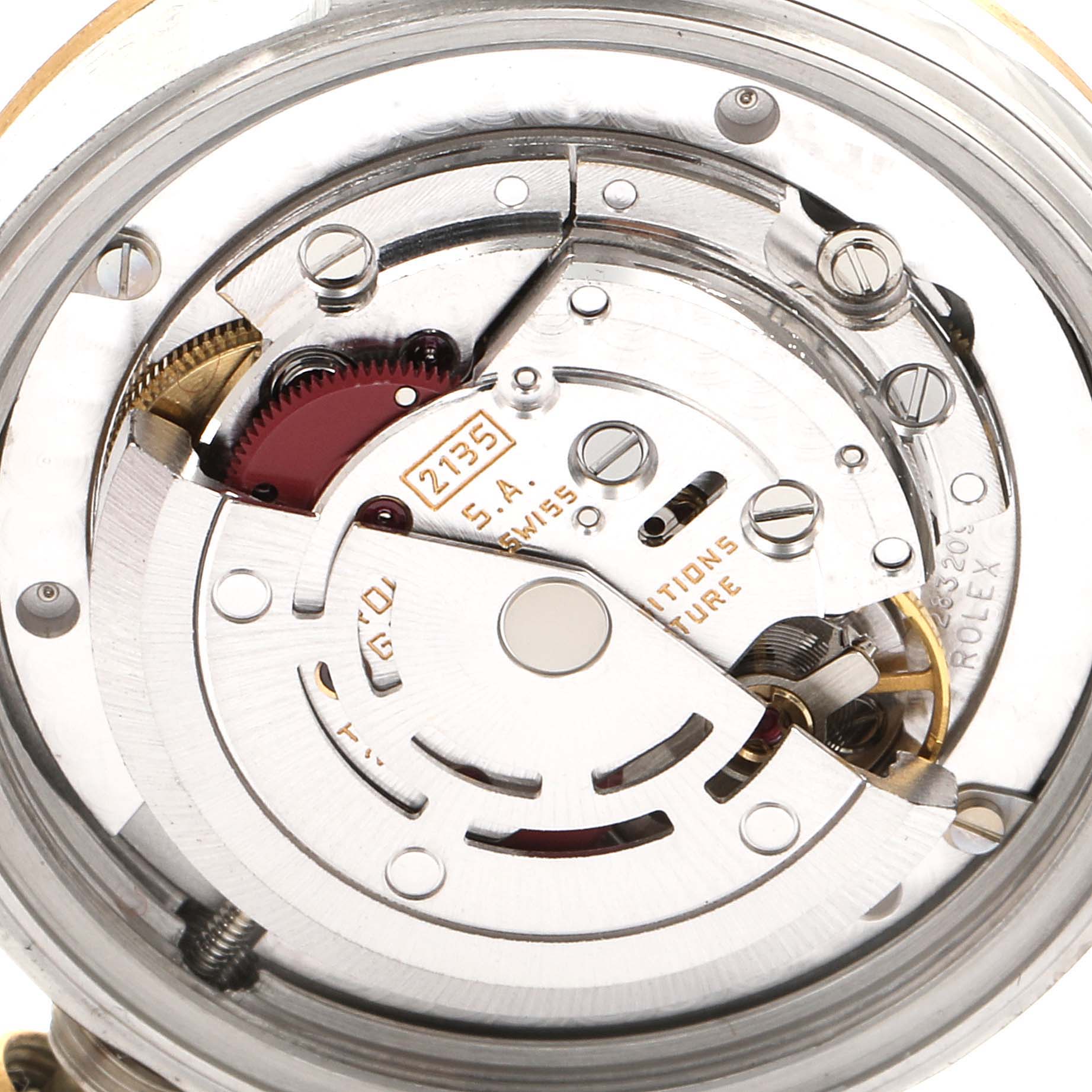 This is a close-up view of the internal mechanisms of a Rolex Mid-Size 68273 Women
s Steel and Gold (two tone) Champagne Dial 68273 Women
s Steel and Gold (two tone) Champagne Dial model watch, showcasing its intricate movement parts.