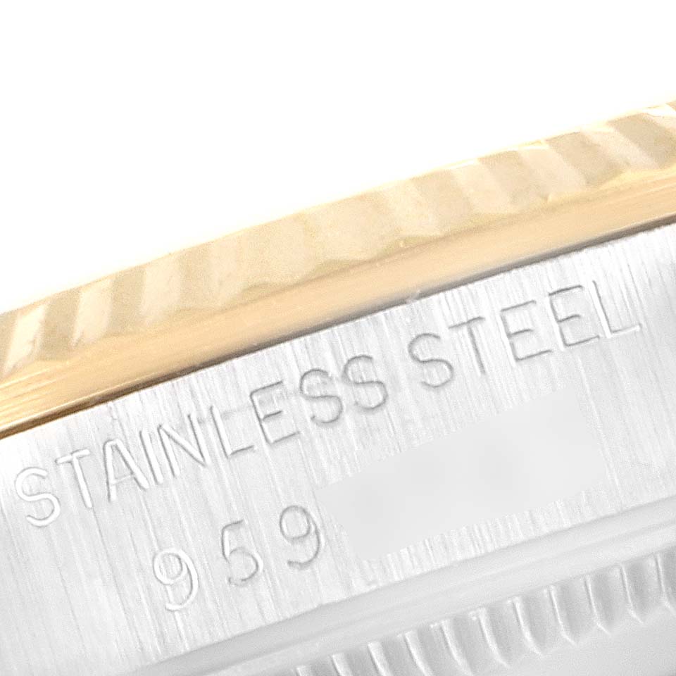 This close-up shows the engraving of "STAINLESS STEEL" and part of the serial number on the case of a Rolex Mid-Size 68273 Women
s Steel and Gold (two tone) Champagne Dial 68273 Women
s Steel and Gold (two tone) Champagne Dial model watch.