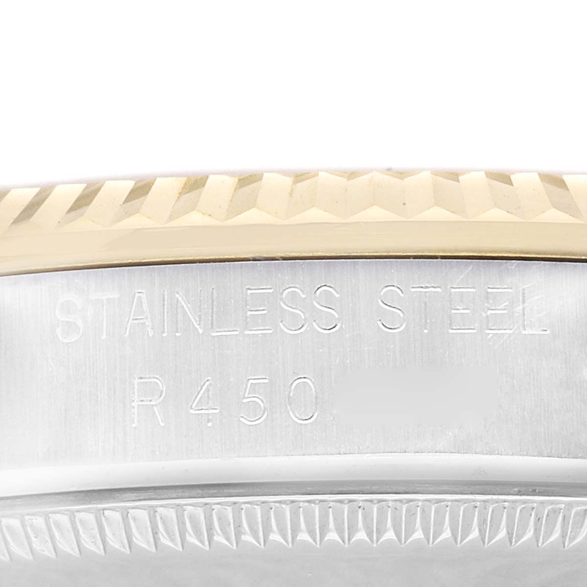 This is a close-up shot of the side of a Rolex Mid-Size 68273 Women's Steel and Gold (two tone) Champagne Dial 68273 Women's Steel and Gold (two tone) Champagne Dial model watch, showing the stainless steel casing and part of the bezel.