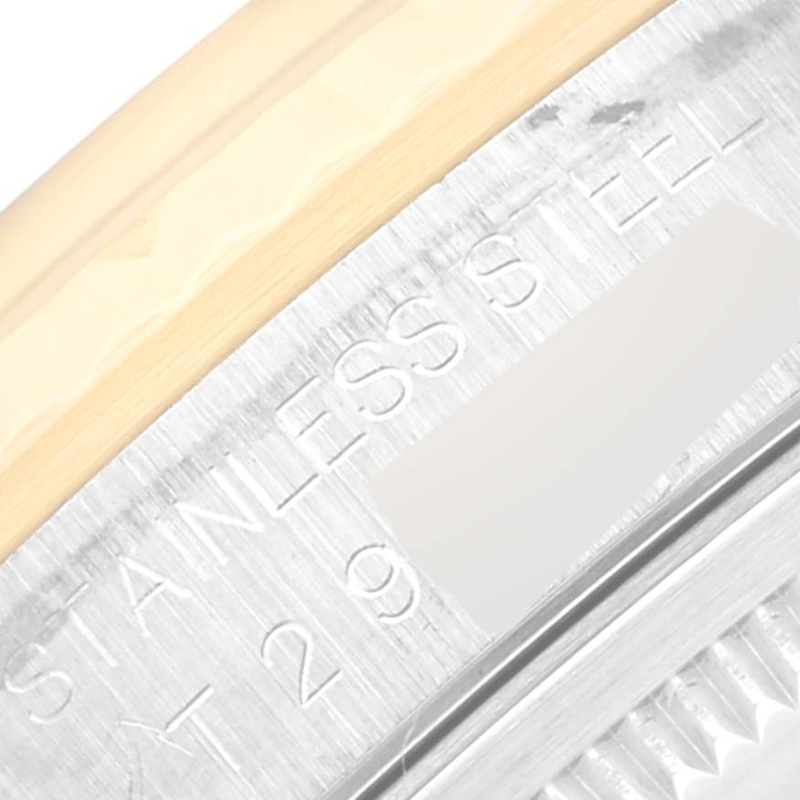 The image shows an angled close-up of the stainless steel case of a Rolex Datejust 16233 Men's Steel and Gold (two tone) Grey Dial 16233 Men's Steel and Gold (two tone) Grey Dial watch, highlighting the engraved text.