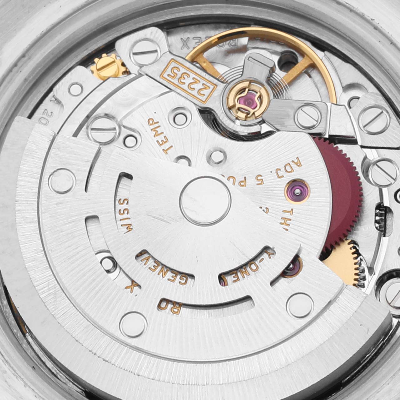 This close-up image shows the intricate internal movement mechanism of a Rolex Datejust 179171 Women's Steel and Gold (two tone) White Dial 179171 Women's Steel and Gold (two tone) White Dial watch.