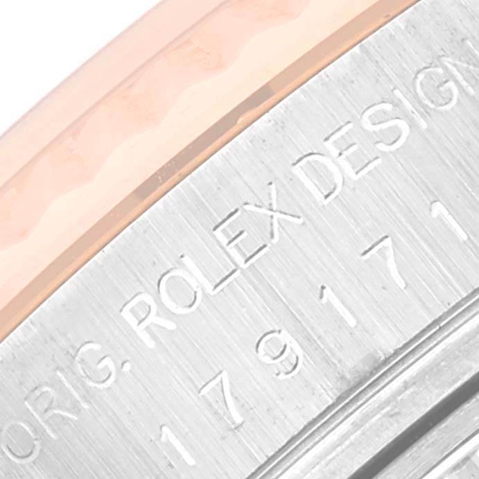 This image shows a close-up of the engraved side of a Rolex Datejust 179171 Women's Steel and Gold (two tone) White Dial 179171 Women's Steel and Gold (two tone) White Dial watch.