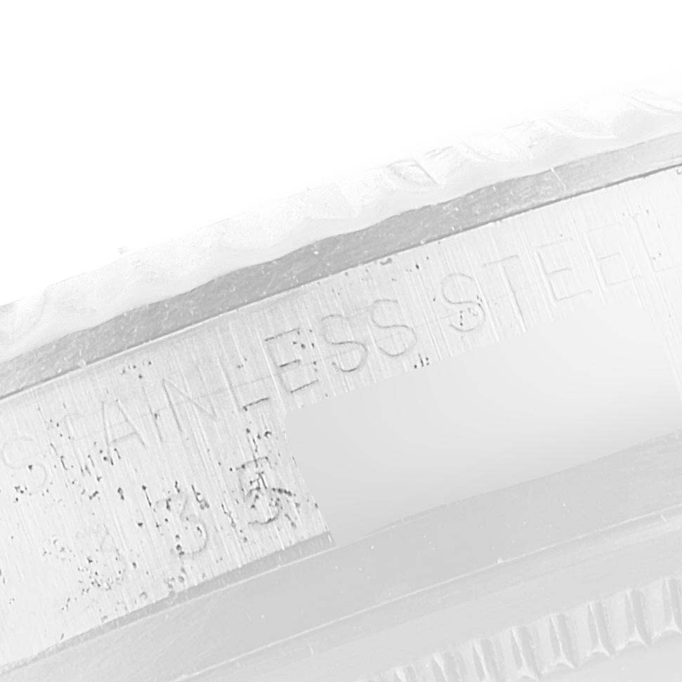 This image shows a close-up of the case side engraving on a Vintage Collection model by Rolex, highlighting "Stainless Steel."
