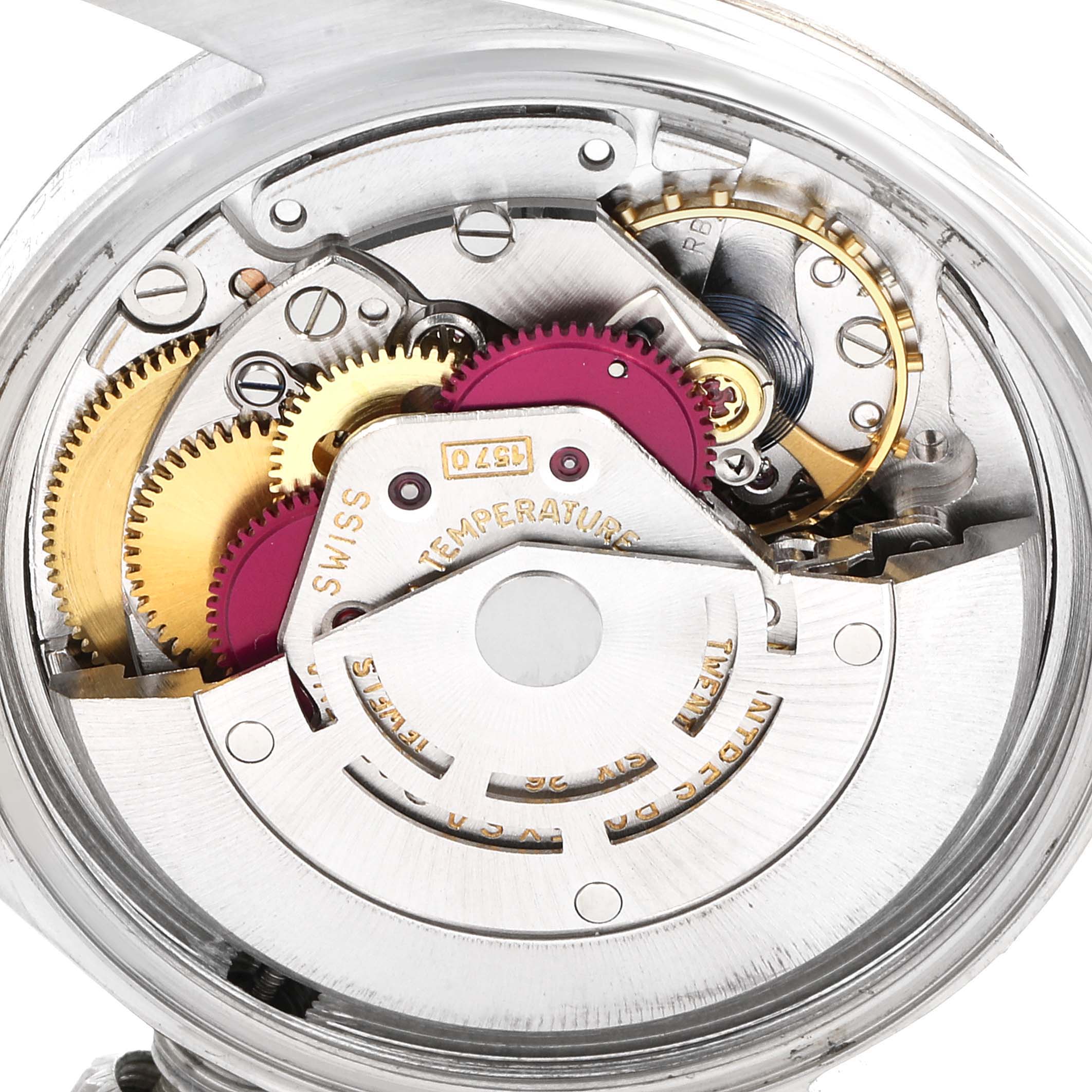 The image shows the intricate internal mechanism and gears of a Rolex Vintage Collection 1601 Men
s Stainless Steel Silver Dial 1601 Men
s Stainless Steel Silver Dial watch from a close-up angle.