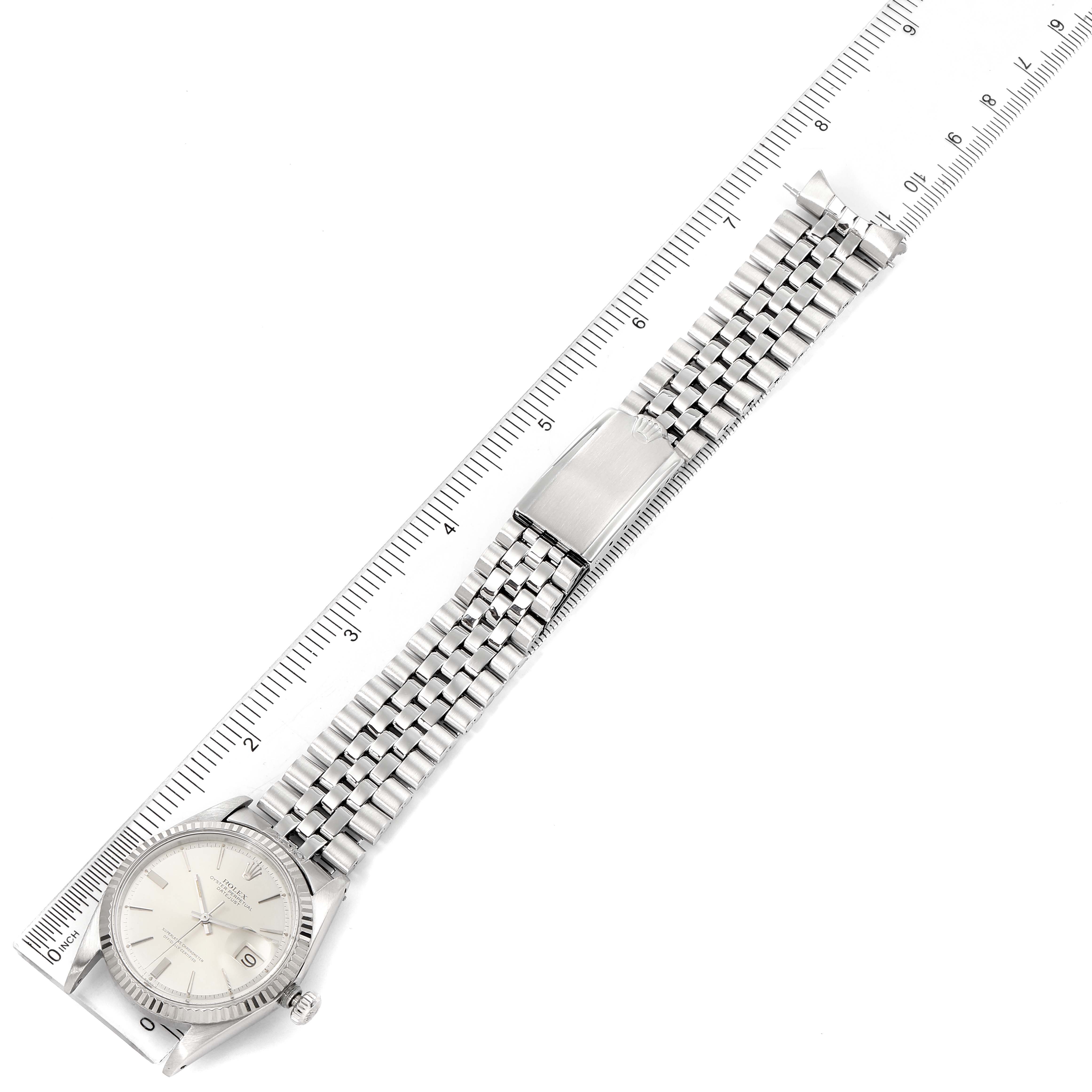 The watch is a Vintage Collection model by Rolex, shown from a top-down angle, displaying the entire watch face and bracelet alongside a ruler.