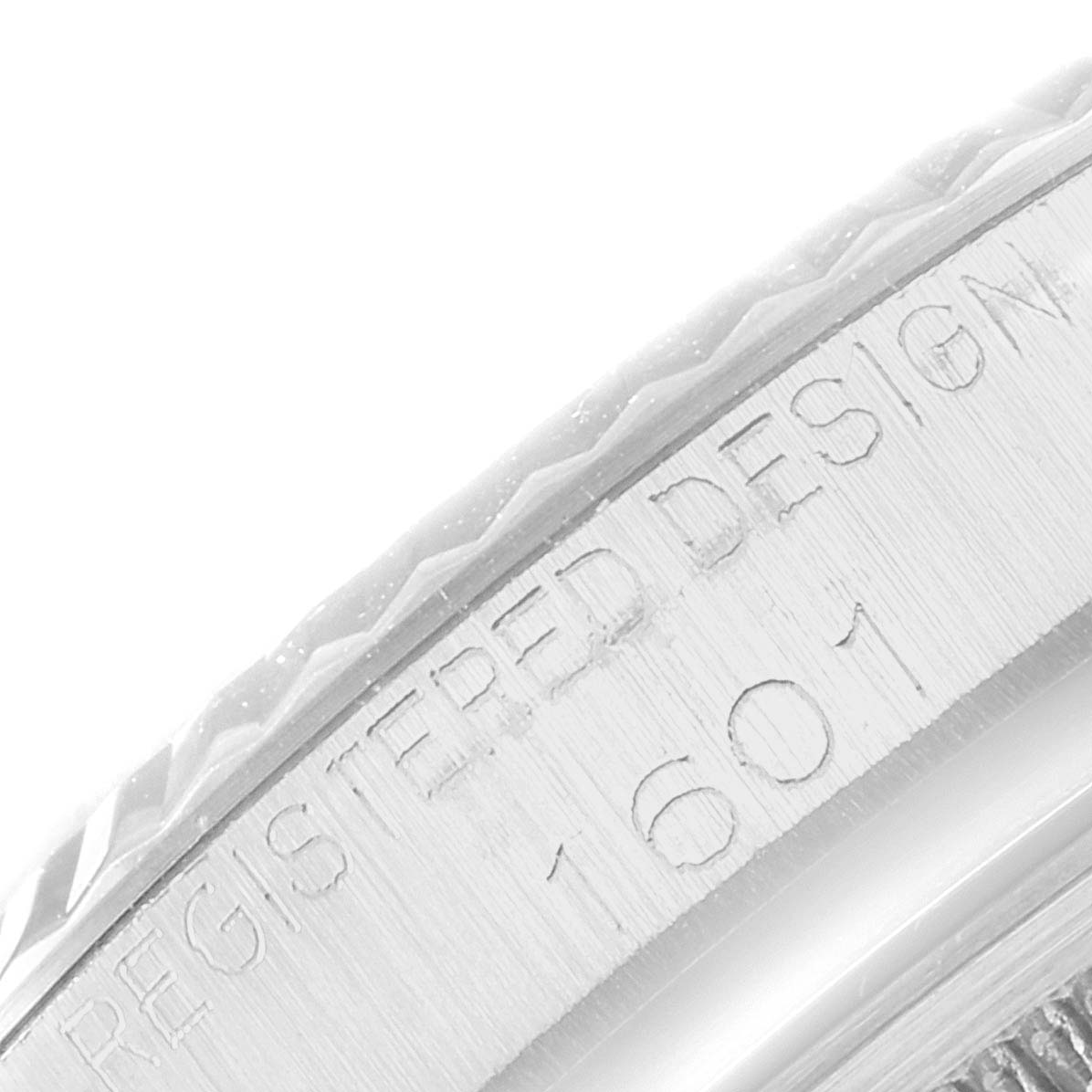 This image shows a macro view of the case edge engraving on the Rolex Vintage Collection 1601 Men
s Stainless Steel Silver Dial 1601 Men
s Stainless Steel Silver Dial model 1601.