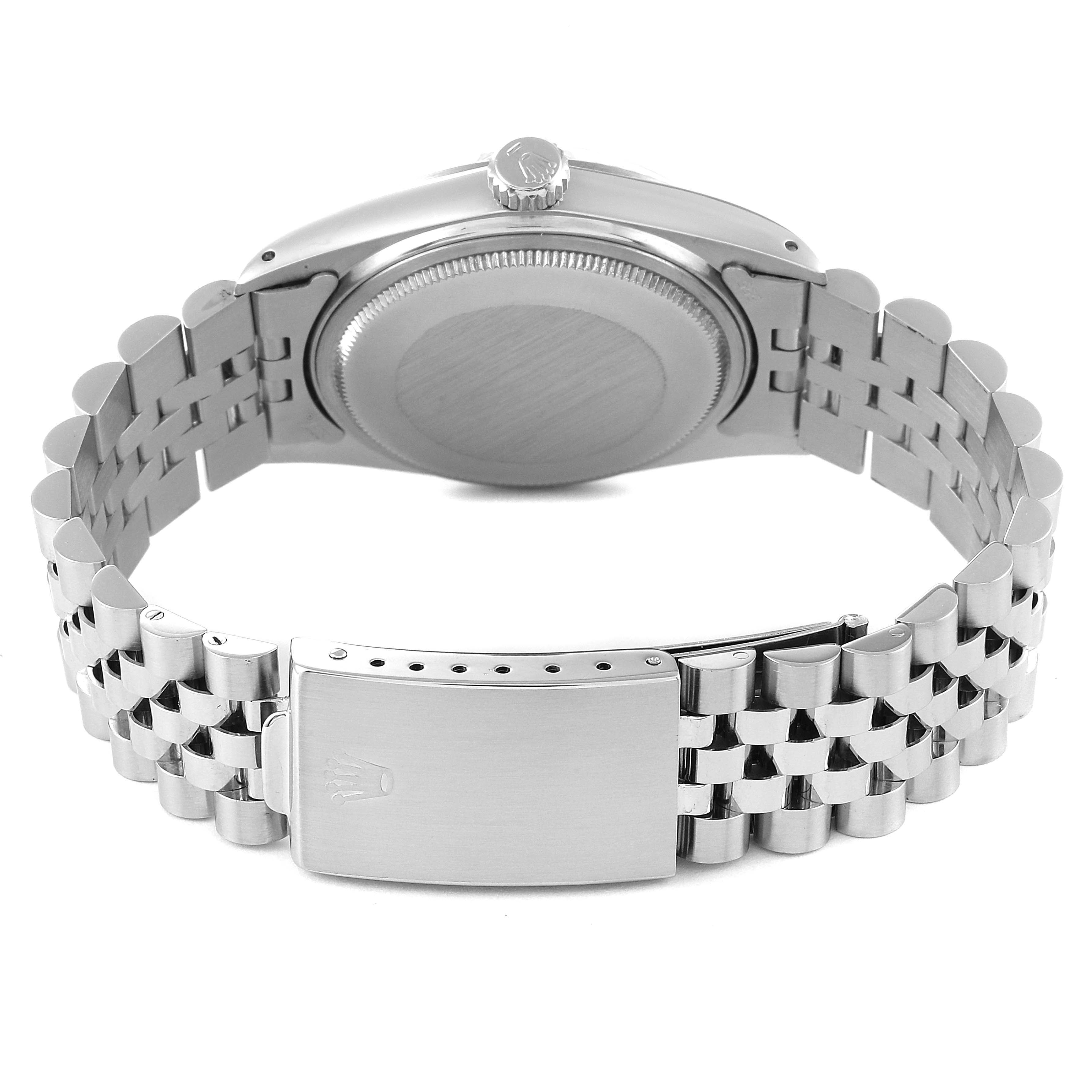 This image shows the back view of the Rolex Vintage Collection 16014 Men
s Stainless Steel Silver Dial 16014 Men
s Stainless Steel Silver Dial watch, highlighting the stainless steel case back and bracelet with a clasp.