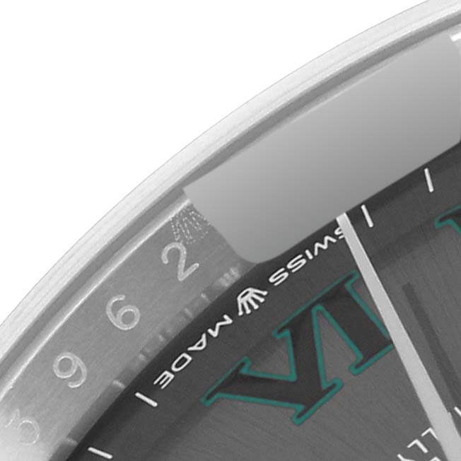 This close-up image of a Rolex Datejust 126234 Men's Stainless Steel Grey Dial 126234 Men's Stainless Steel Grey Dial watch shows the edge of the dial, partial date display, and part of the "Swiss Made" text.