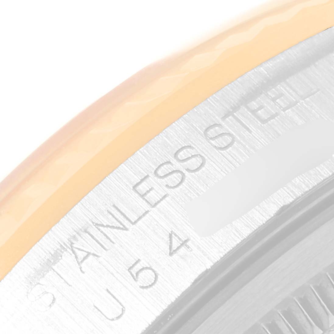 This image shows a close-up of the case back of a Rolex Datejust 16233 Men's Steel and Gold (two tone) Black Dial 16233 Men's Steel and Gold (two tone) Black Dial, highlighting the "STAINLESS STEEL" engraving.