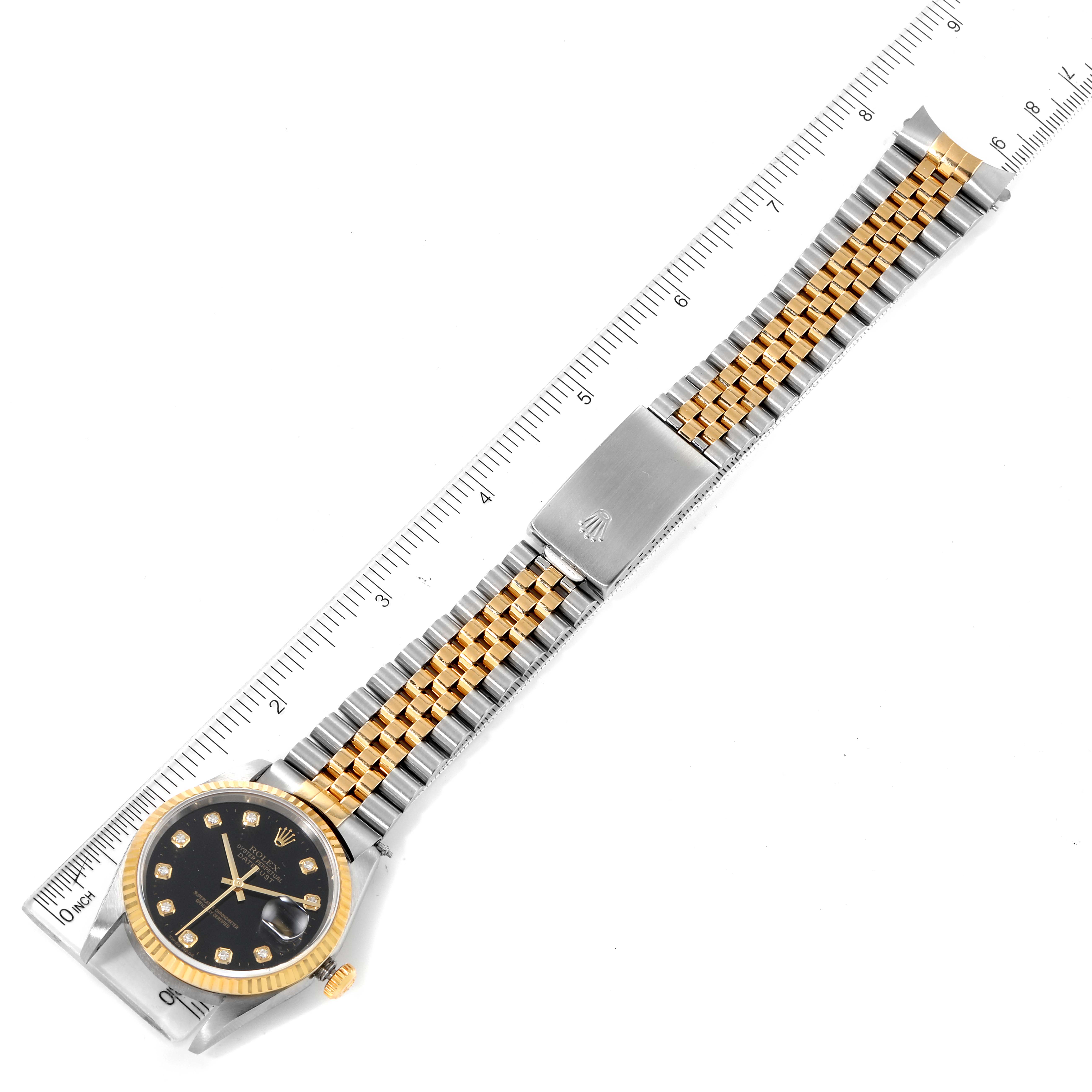 This image shows a top-down view of a Rolex Datejust 16233 Men's Steel and Gold (two tone) Black Dial 16233 Men's Steel and Gold (two tone) Black Dial watch, highlighting its two-tone bracelet and black dial.