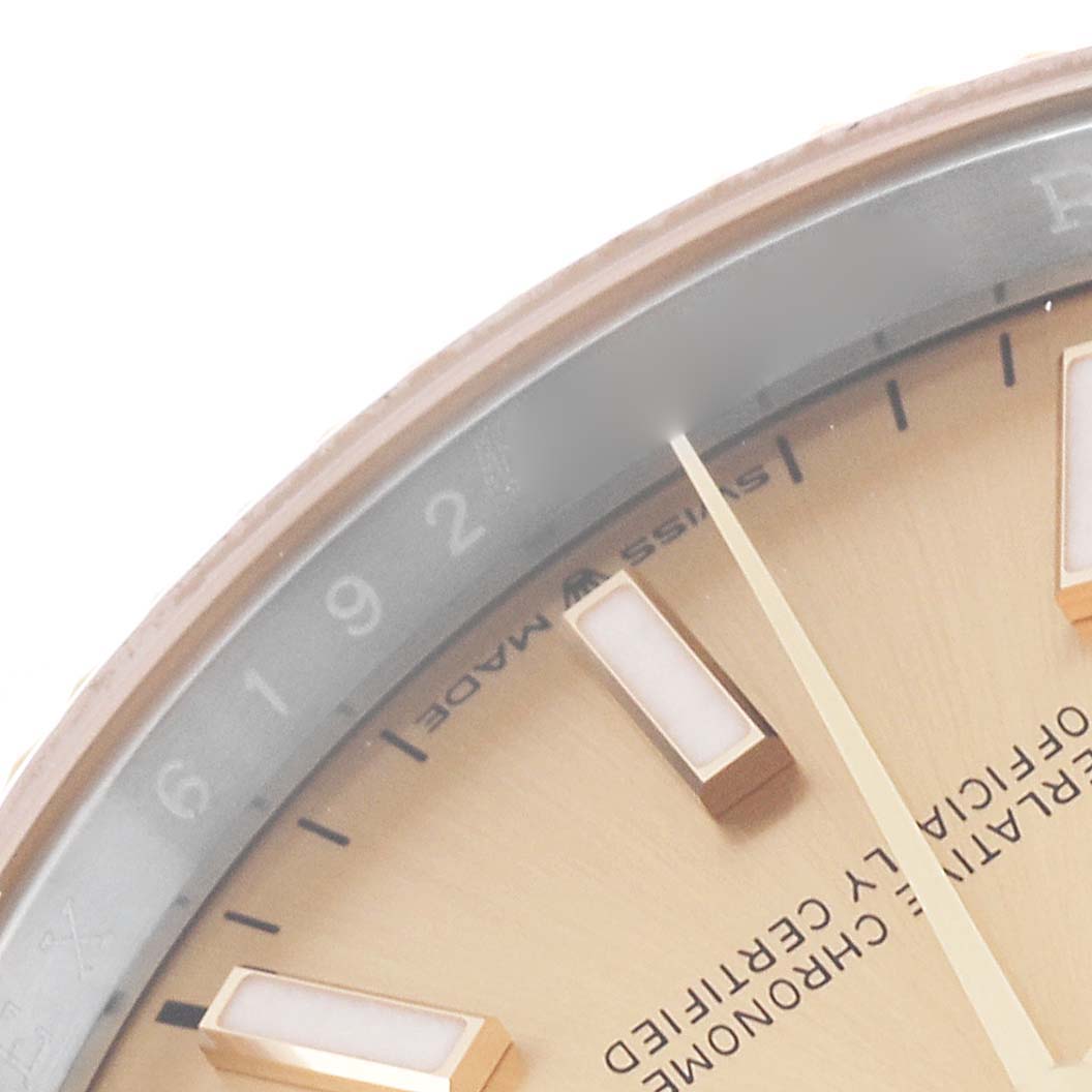 The image shows a close-up of the dial and part of the bezel of a Rolex Datejust 126233 Men's Steel and Gold (two tone) Champagne Dial 126233 Men's Steel and Gold (two tone) Champagne Dial watch.