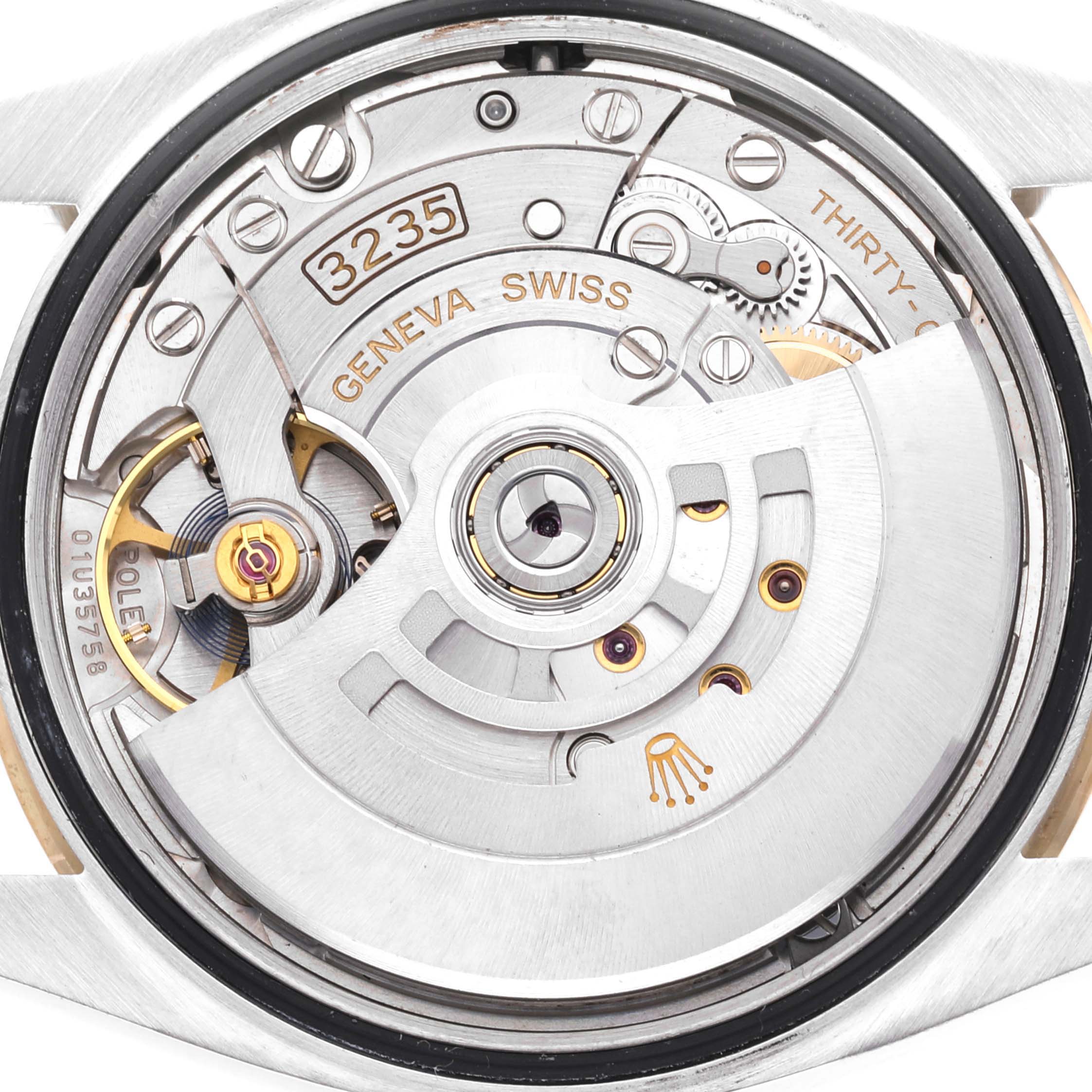 The image shows the movement mechanism of a Rolex Datejust 126233 Men's Steel and Gold (two tone) Champagne Dial 126233 Men's Steel and Gold (two tone) Champagne Dial watch from a back angle.