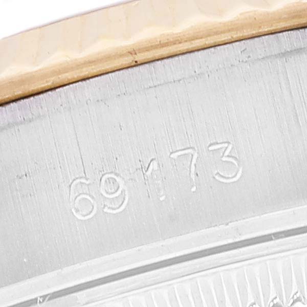 This image shows the side view of the casing and part of the bezel of a Rolex Datejust 69173 Women's Steel and Gold (two tone) Champagne Dial 69173 Women's Steel and Gold (two tone) Champagne Dial watch, displaying the model number.