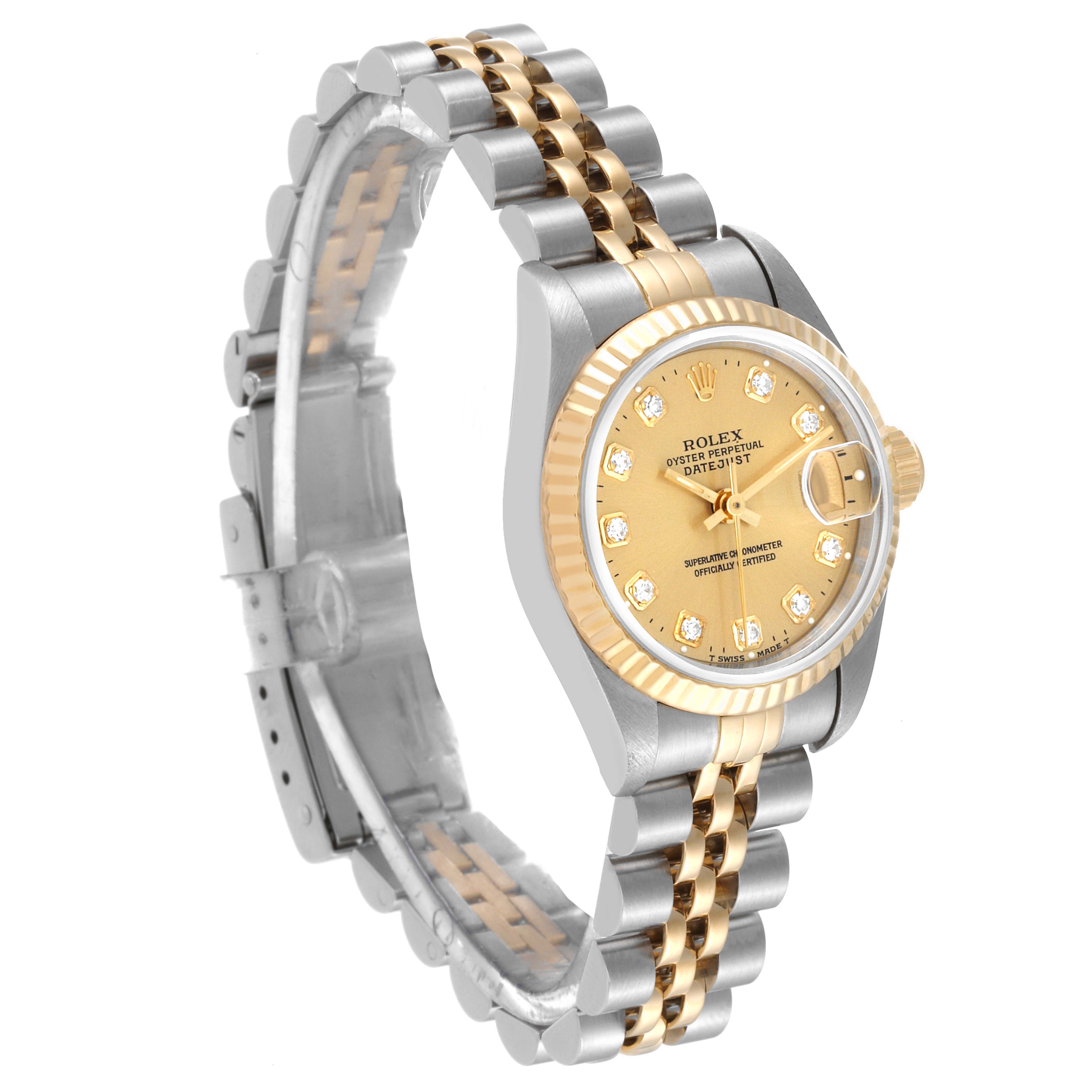 The image shows a Rolex Datejust 69173 Women's Steel and Gold (two tone) Champagne Dial 69173 Women's Steel and Gold (two tone) Champagne Dial watch at a three-quarter angle, highlighting its gold dial, fluted bezel, and two-tone bracelet.