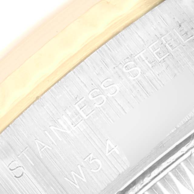 This close-up image shows part of the stainless steel case back with inscriptions for the Rolex Datejust 69173 Women's Steel and Gold (two tone) Champagne Dial 69173 Women's Steel and Gold (two tone) Champagne Dial watch.