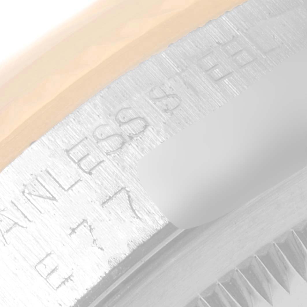 This close-up image shows the "Stainless Steel" inscription on the casing of a Rolex Datejust 16233 Men's Steel and Gold (two tone) Champagne Dial 16233 Men's Steel and Gold (two tone) Champagne Dial watch.
