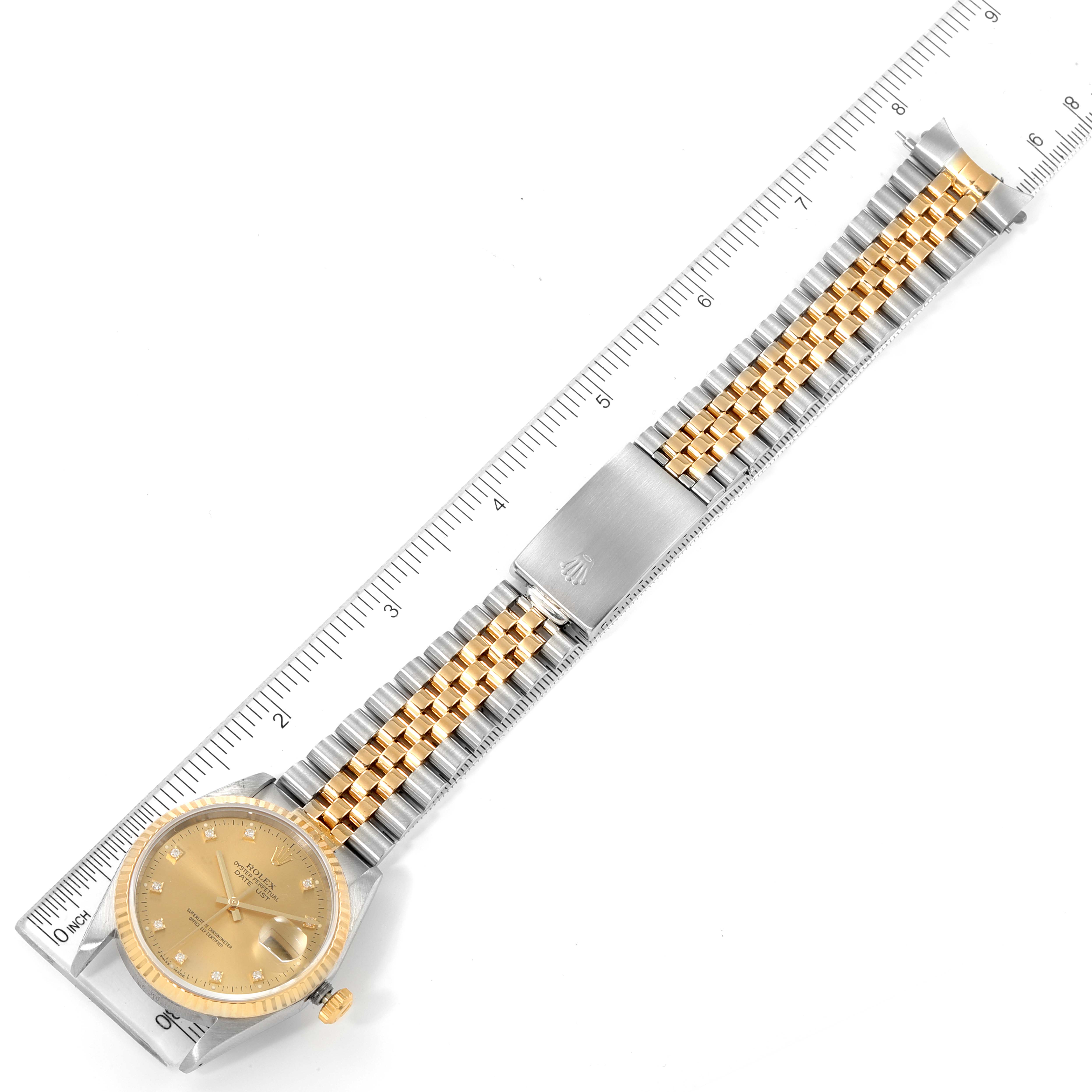 The image shows a top-down view of a Rolex Datejust 16233 Men's Steel and Gold (two tone) Champagne Dial 16233 Men's Steel and Gold (two tone) Champagne Dial watch, displaying the face, bezel, and the two-tone bracelet with a clasp.