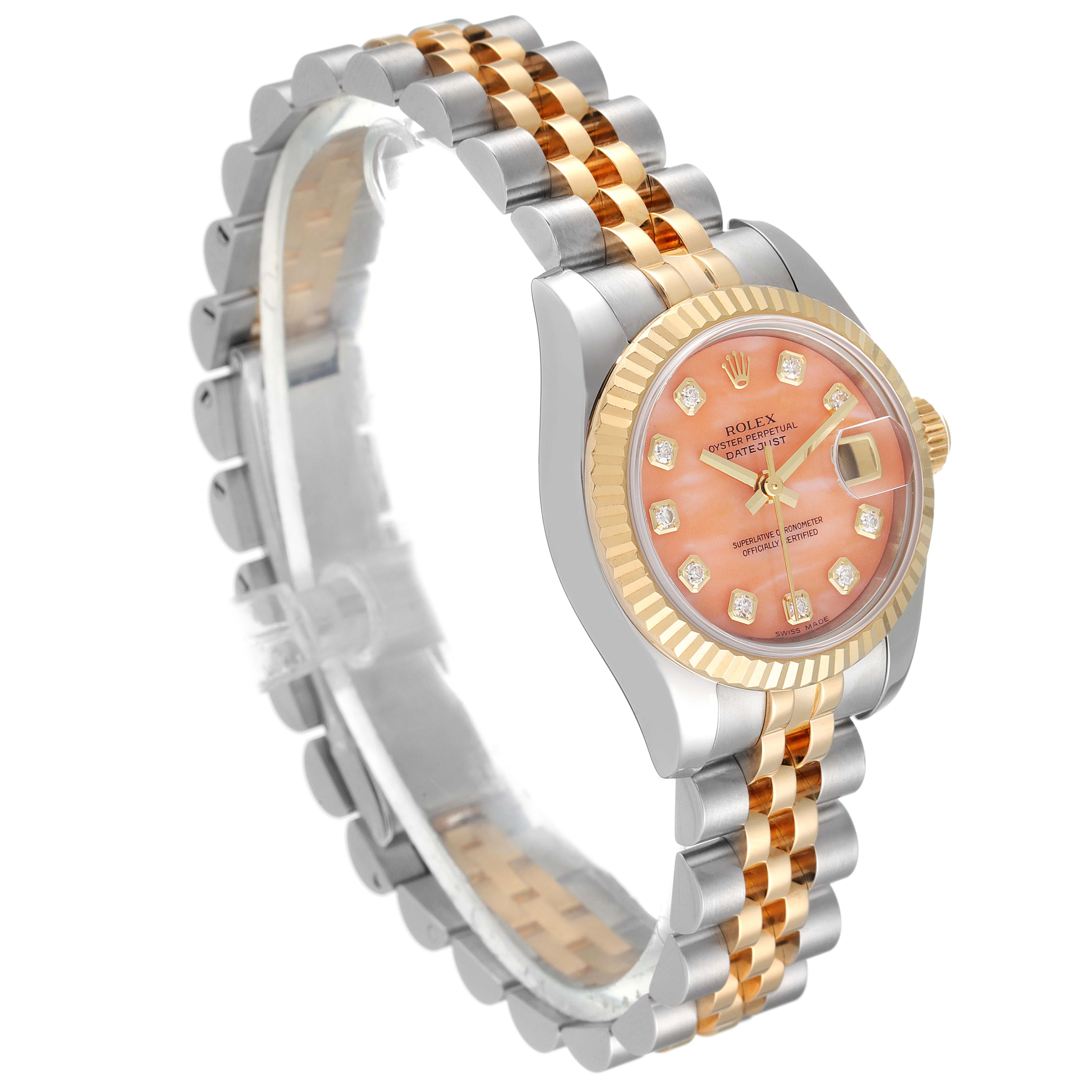 This image shows a Rolex Datejust 179173 Women's Steel and Gold (two tone) Pink Dial 179173 Women's Steel and Gold (two tone) Pink Dial watch at a 3/4 angle, highlighting its pink dial, two-tone bracelet, and fluted bezel.