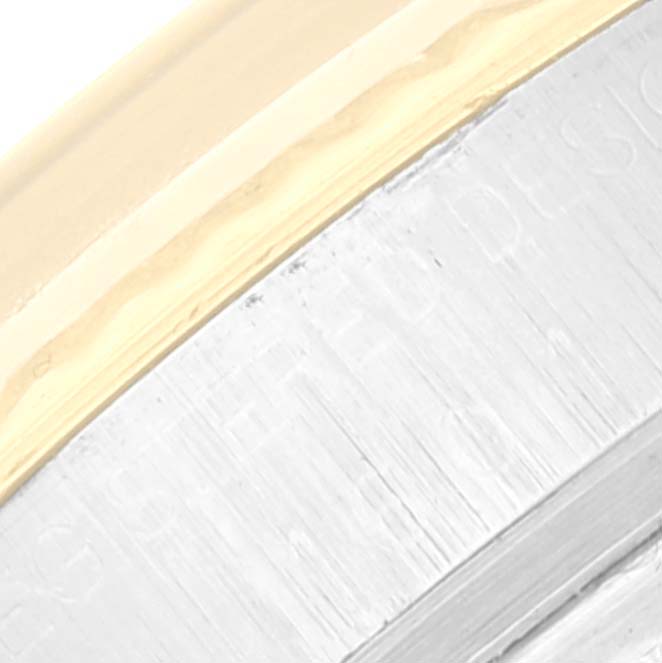 This image shows a close-up of the bezel and case of a Vintage Collection model by Rolex.