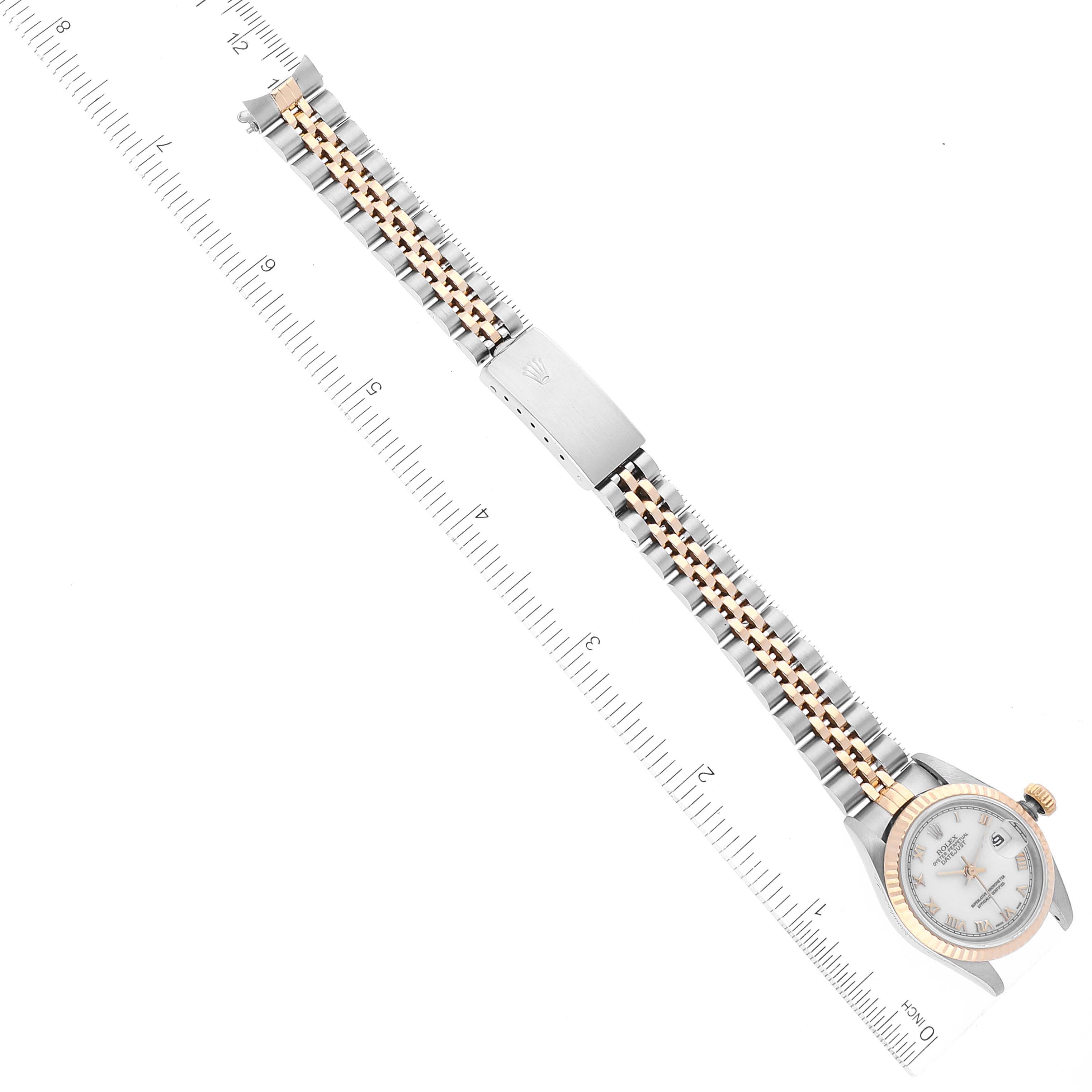 The image shows a Rolex Datejust 69173 Women's Steel and Gold (two tone) White Dial 69173 Women's Steel and Gold (two tone) White Dial watch laid flat, displaying its face, fluted bezel, and two-tone Jubilee bracelet, measured against a ruler.