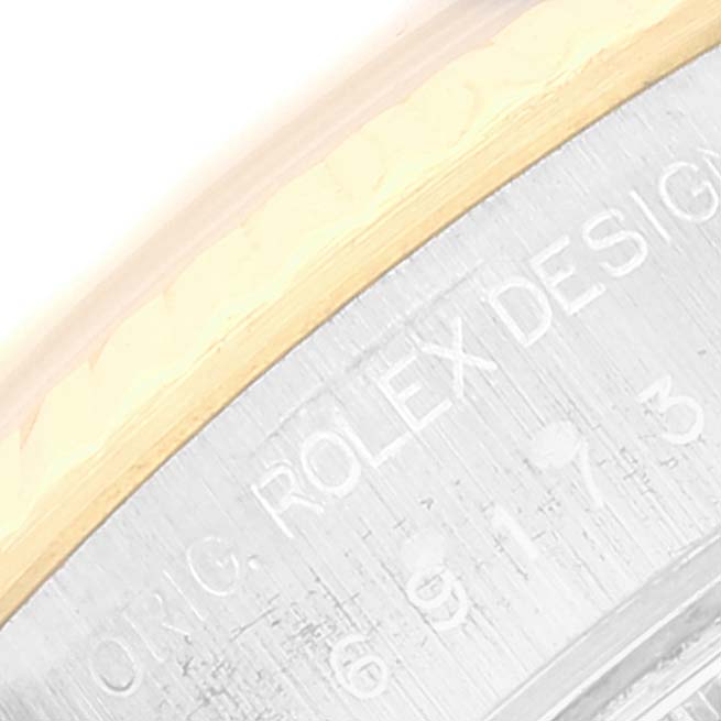 The image shows a close-up of the outer edge of the casing of a Rolex Datejust 69173 Women's Steel and Gold (two tone) White Dial 69173 Women's Steel and Gold (two tone) White Dial watch, highlighting the engraved model details.