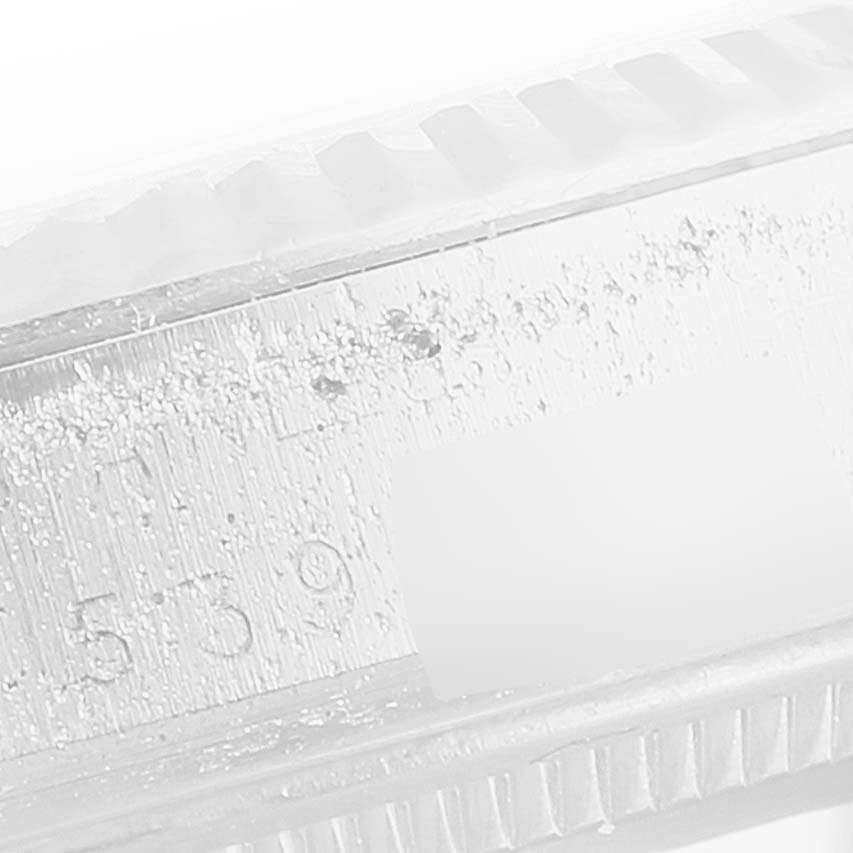 This image shows a close-up of the side of the case and bezel of a Vintage Collection Rolex watch.