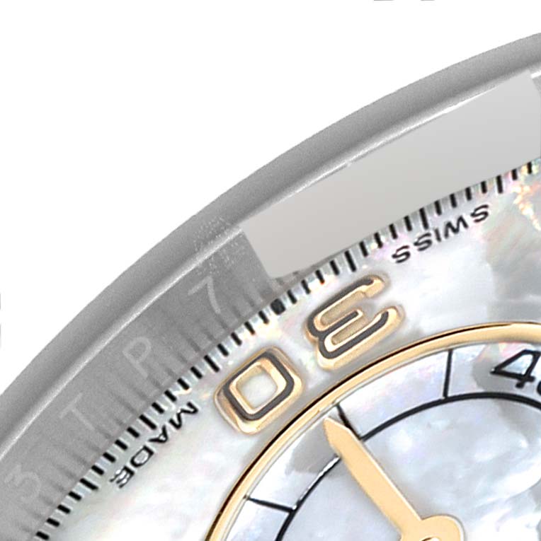 This image shows a close-up of the dial and bezel of a Rolex Daytona 116503 Men's Steel and Gold (two tone) Mother of Pearl Dial 116503 Men's Steel and Gold (two tone) Mother of Pearl Dial watch, focusing on the numbers and part of the minute track.