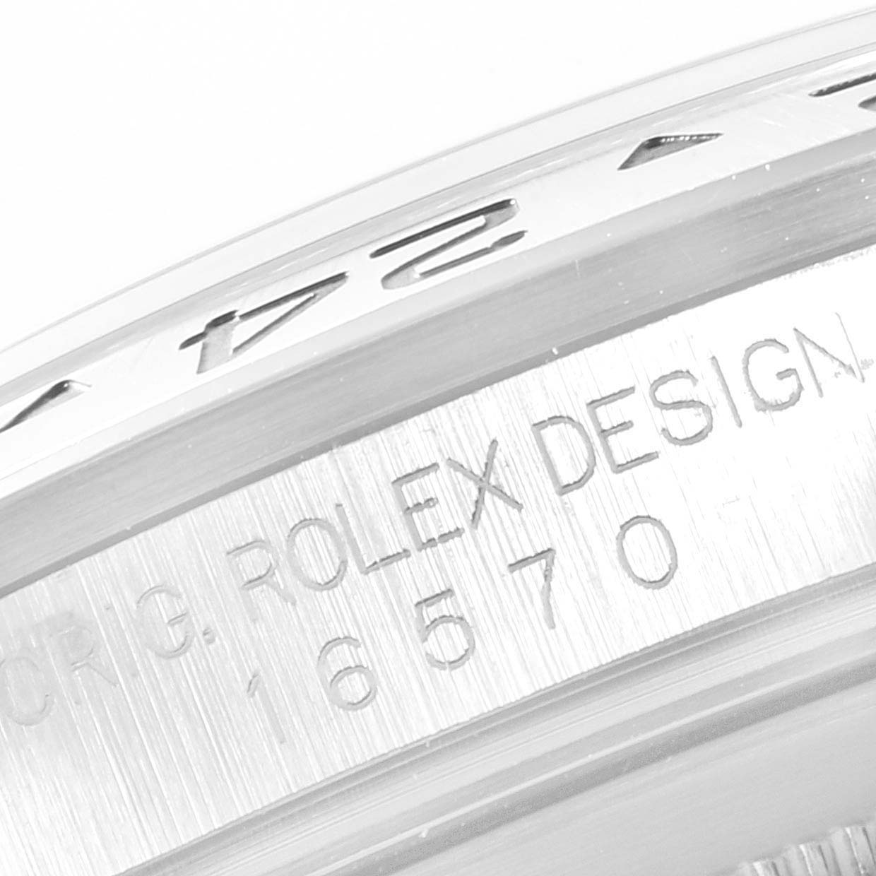 The image shows a close-up of the case side engraving and part of the bezel of a Rolex Explorer 16570 Men
s Stainless Steel Black Dial 16570 Men
s Stainless Steel Black Dial model.