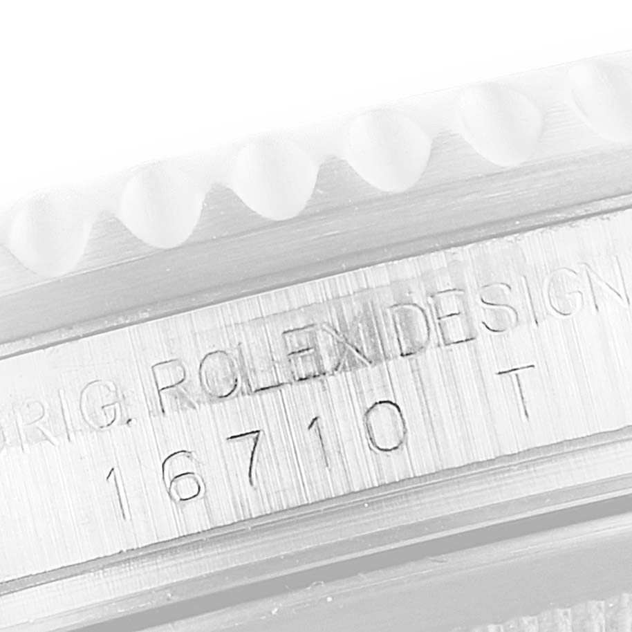 This close-up image shows the model number and design inscription on the case side of a Rolex GMT-Master 16710 Men's Stainless Steel Black Dial 16710 Men's Stainless Steel Black Dial.