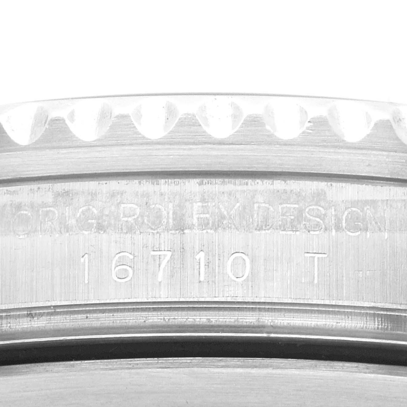 This is a close-up angle of the model number engraving (16710 T) on the case side of a Rolex GMT-Master 16710 Men
s Stainless Steel Black Dial 16710 Men
s Stainless Steel Black Dial watch.