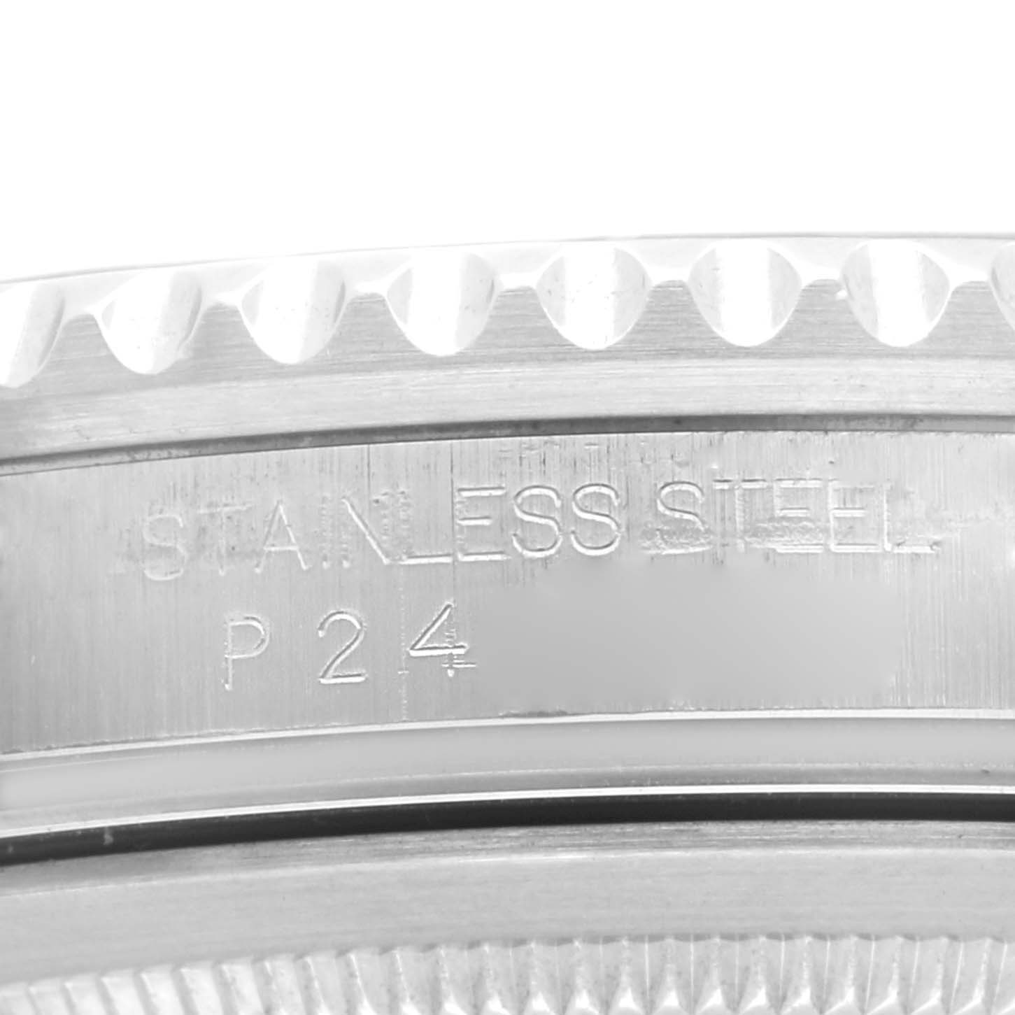 The image shows a close-up of the steel bezel and edge engraving on a Rolex GMT-Master 16710 Men
s Stainless Steel Black Dial 16710 Men
s Stainless Steel Black Dial watch.