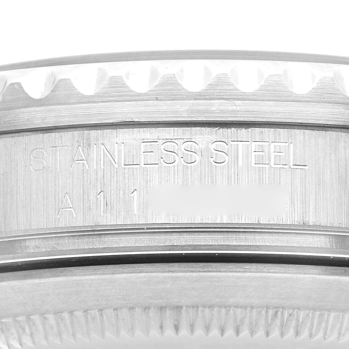 This is a close-up of the stainless steel caseback and part of the bezel of a Rolex GMT-Master 16710 Men's Stainless Steel Black Dial 16710 Men's Stainless Steel Black Dial watch.