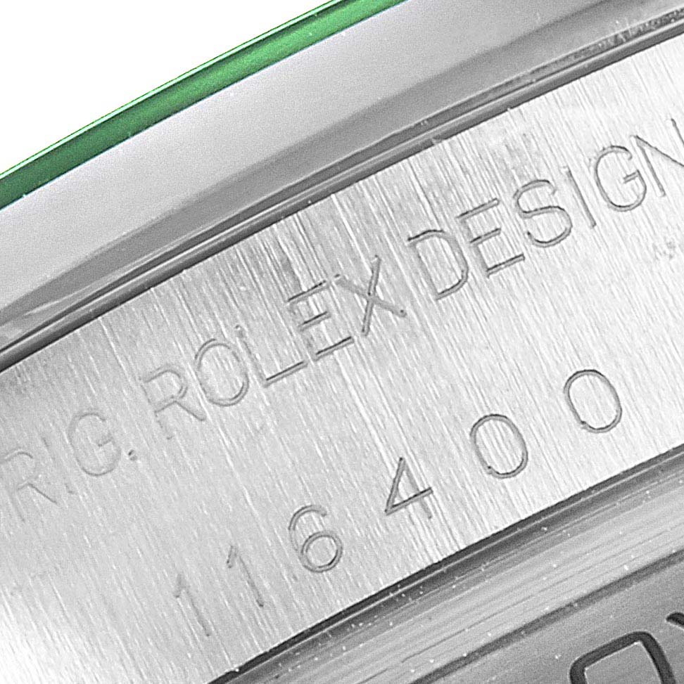 The image shows a close-up of the engraved serial number and “ROLEX DESIGN” text on the side of a Rolex Milgauss 116400V Men's Stainless Steel Black Dial 116400V Men's Stainless Steel Black Dial watch case.
