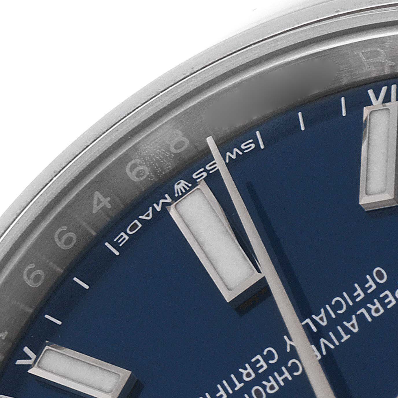 This close-up image shows the edge of the dial and indices of a Rolex Oyster Perpetual 124200 Men's Stainless Steel Blue Dial 124200 Men's Stainless Steel Blue Dial watch with a blue dial.