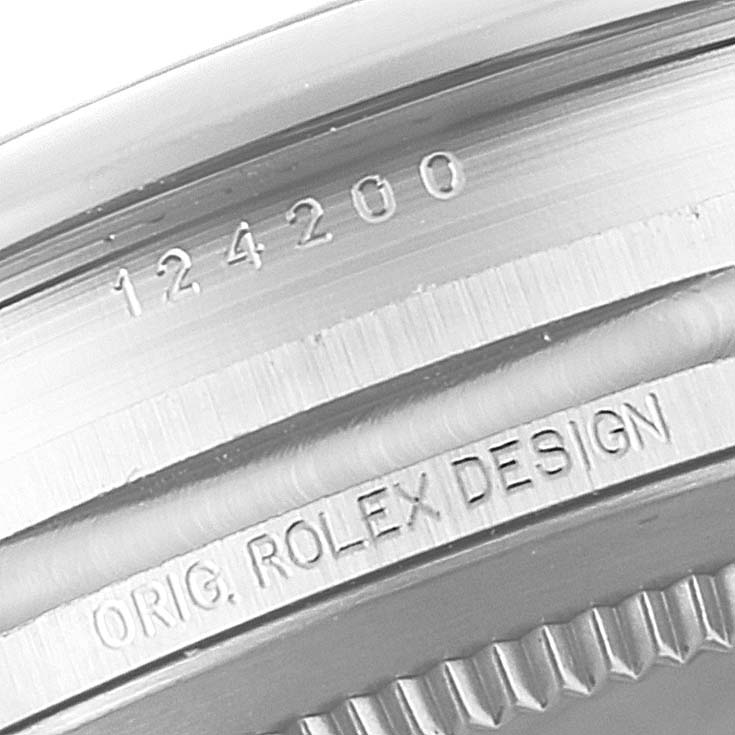 This image shows a close-up of the side of the bezel and case with model number engraving on a Rolex Oyster Perpetual 124200 Men's Stainless Steel Blue Dial 124200 Men's Stainless Steel Blue Dial watch.
