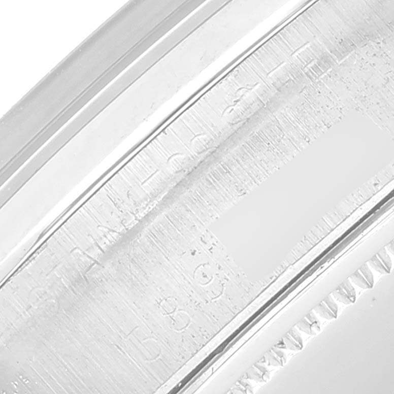 The image shows a close-up view of the metal caseback and part of the bezel of the Rolex Vintage Collection 6694 Men's Stainless Steel Black Dial 6694 Men's Stainless Steel Black Dial watch, highlighting engraved details.