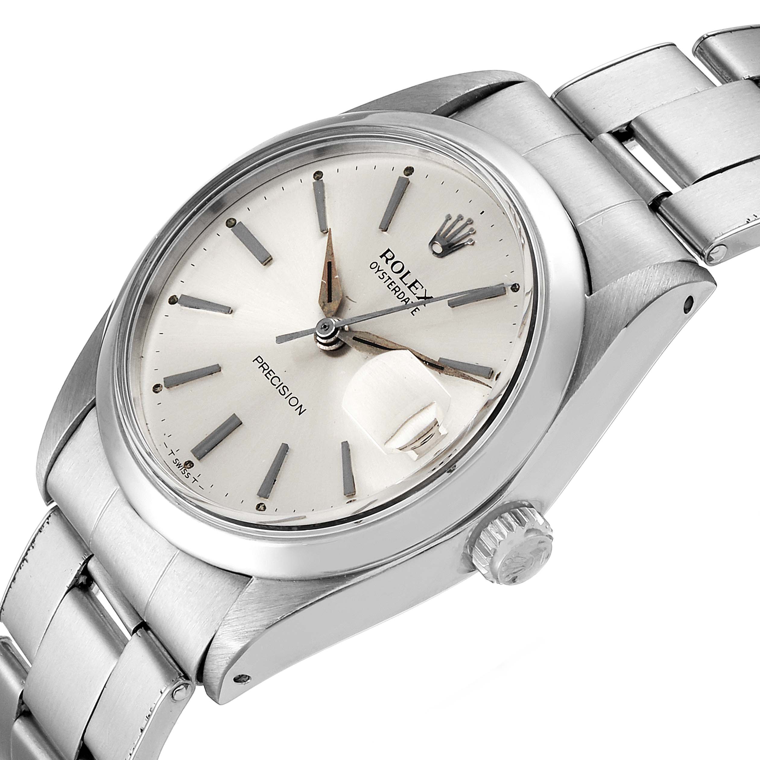 The watch is a Vintage Collection Rolex model, showing the face, bezel, crown, and a portion of the bracelet at an angled view.