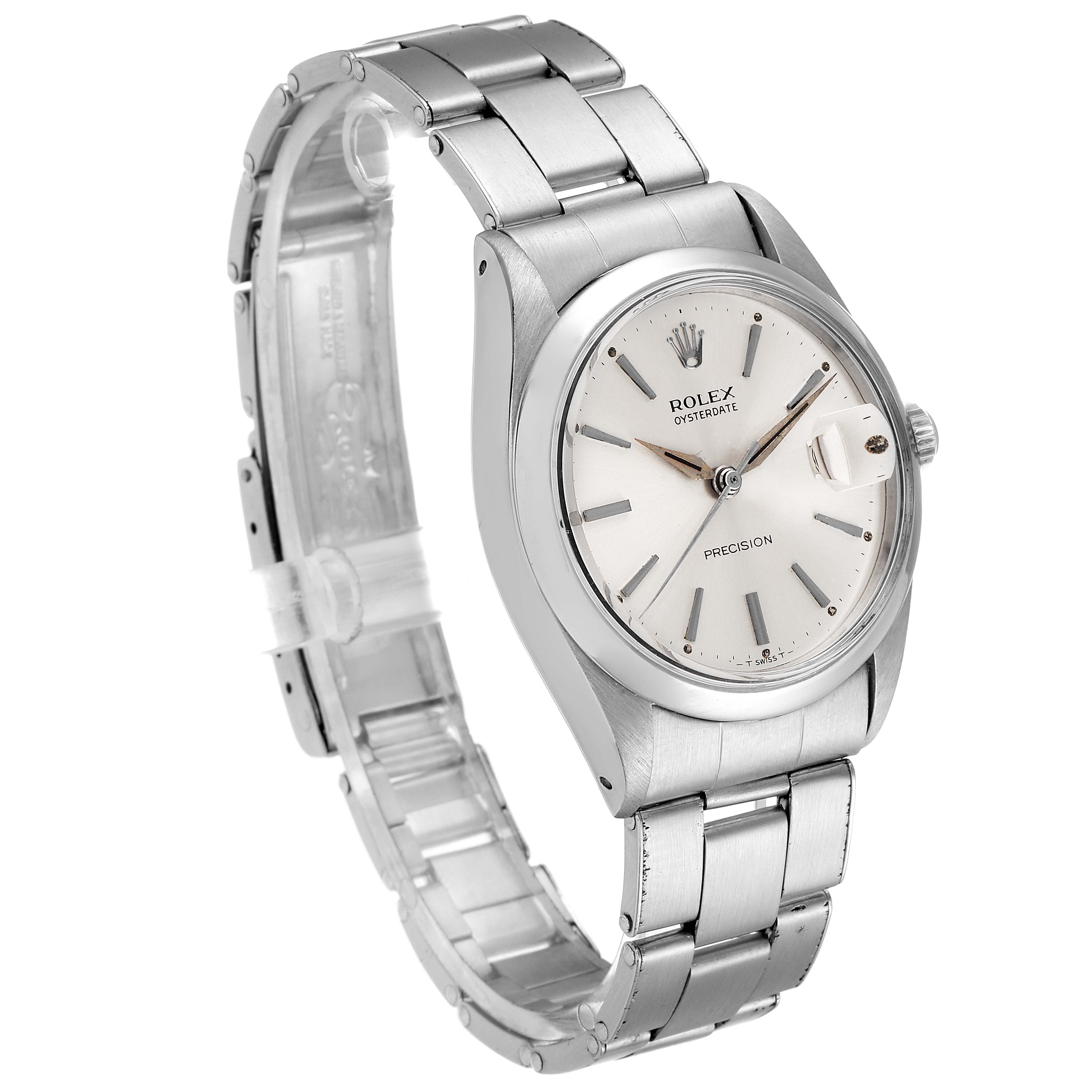 The image shows a Rolex Vintage Collection 6694 Men
s Stainless Steel Silver Dial 6694 Men
s Stainless Steel Silver Dial watch from an angled perspective, highlighting the face and metal strap.