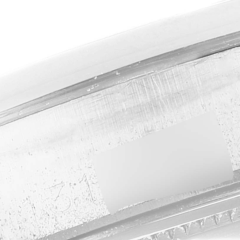 This close-up image shows the bezel and part of the engraved serial number of the Rolex Vintage Collection 6694 Men
s Stainless Steel Silver Dial 6694 Men
s Stainless Steel Silver Dial model.