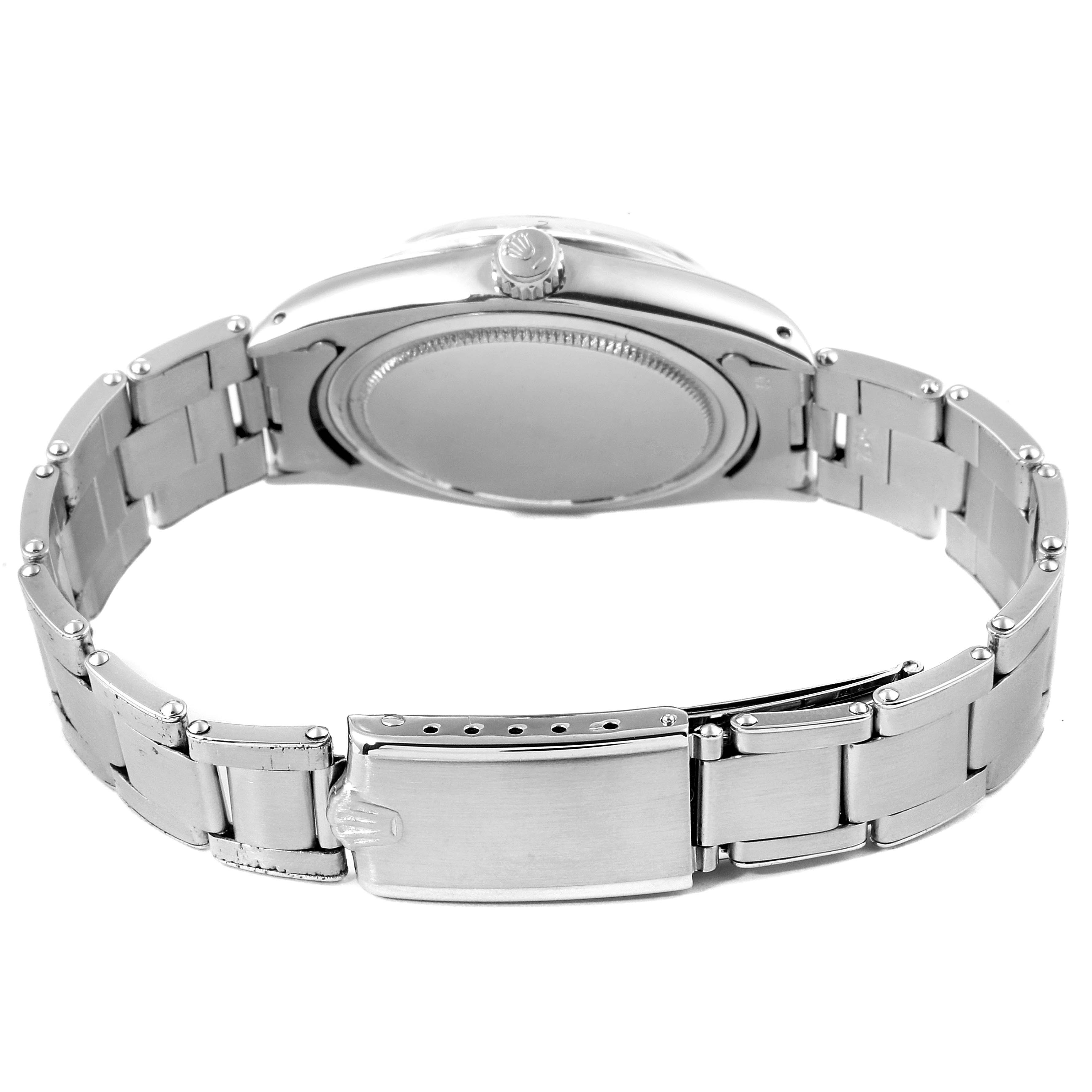 The image shows the backside and bracelet of the Rolex Vintage Collection 6694 Men
s Stainless Steel Silver Dial 6694 Men
s Stainless Steel Silver Dial model, including the clasp and watch case back.