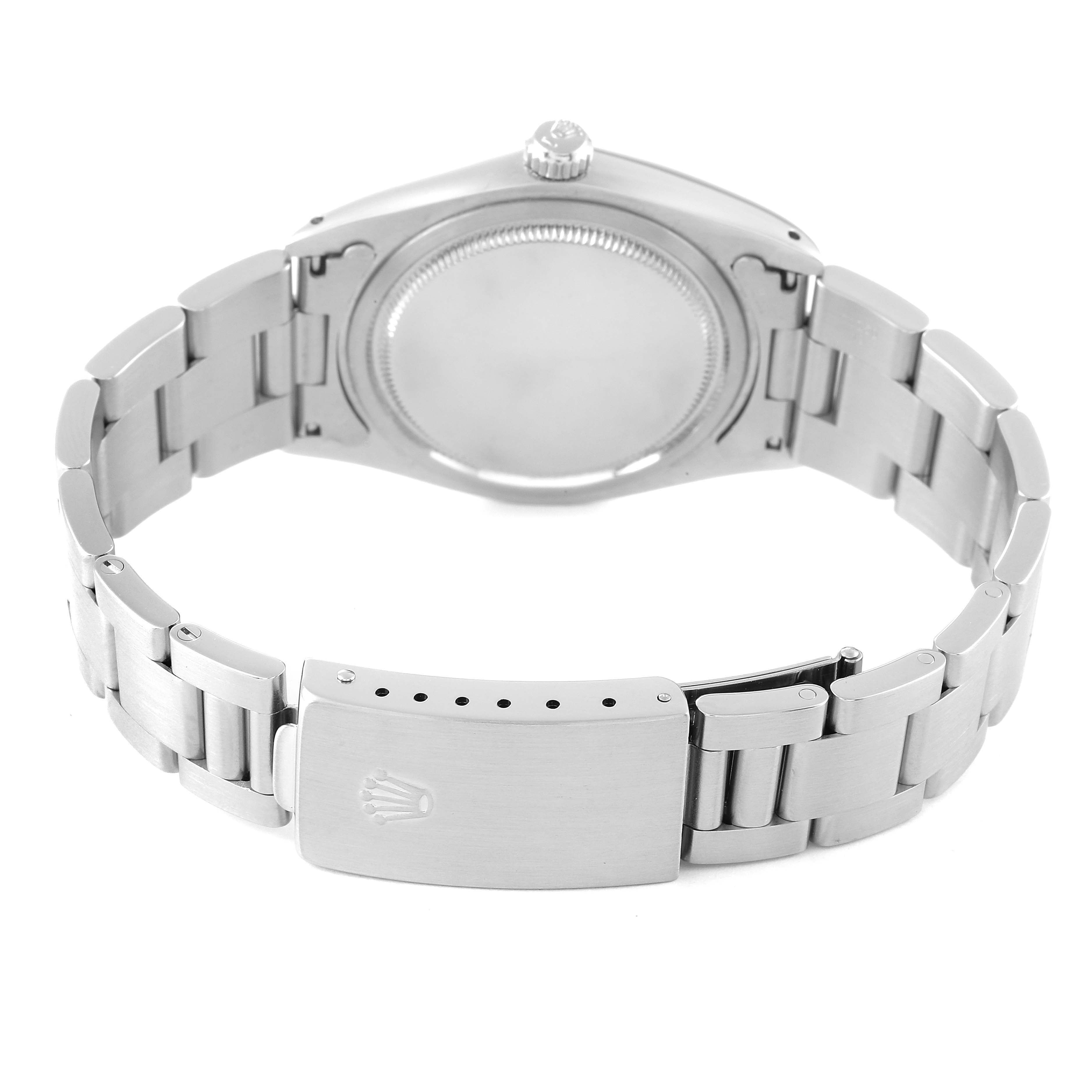 The image shows the back view of a Rolex Vintage Collection 6694 Men
s Stainless Steel Silver Dial 6694 Men
s Stainless Steel Silver Dial watch, featuring its stainless steel bracelet and clasp.