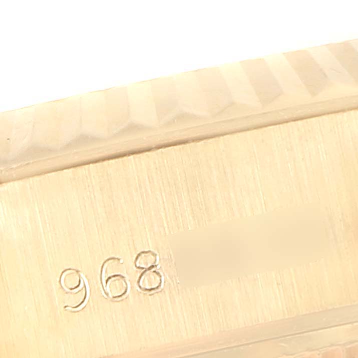 This image shows a close-up of the case side with engraved numbers, presumably the serial number, of a Rolex President 69178 Women
s Yellow Gold Champagne Dial 69178 Women
s Yellow Gold Champagne Dial model watch.