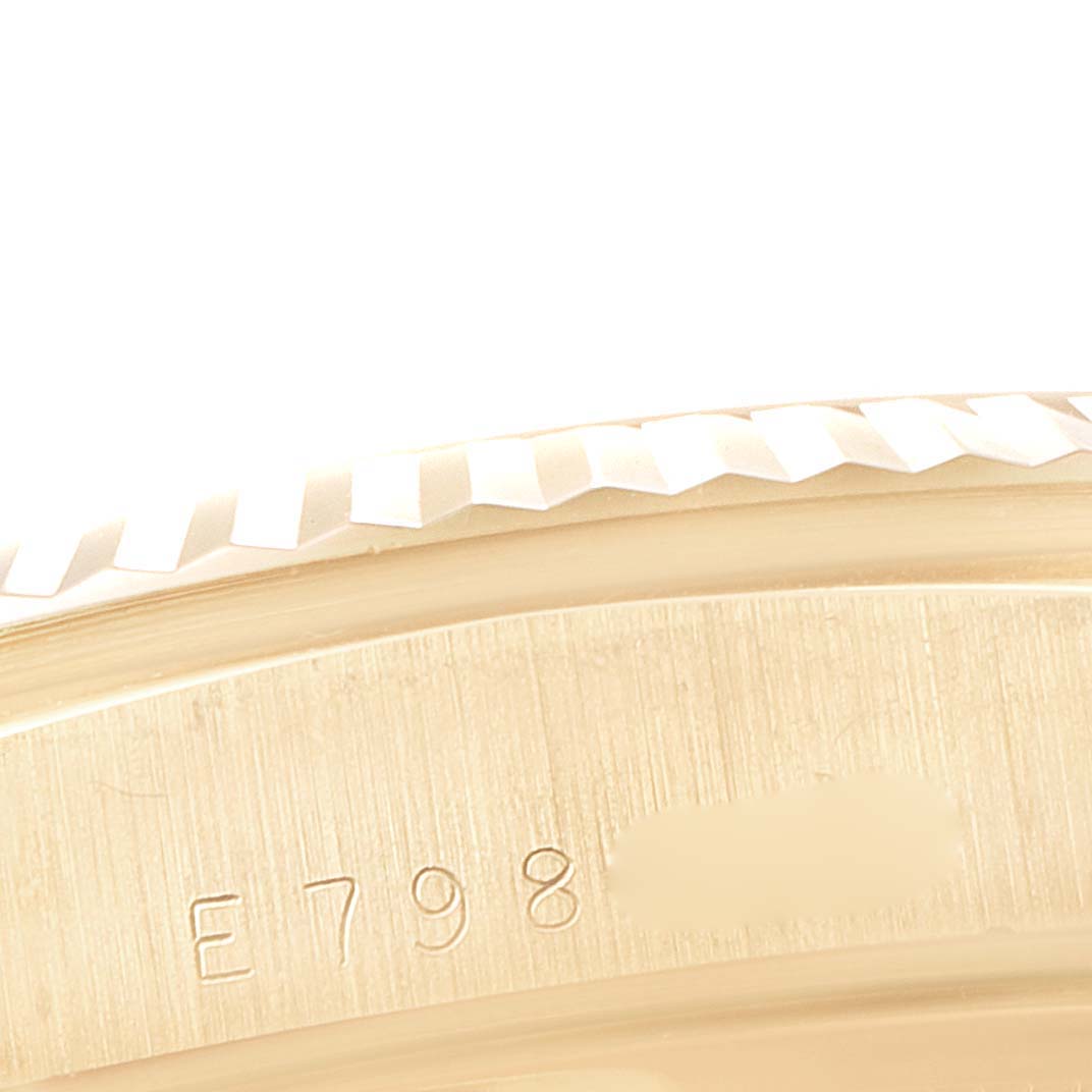 This image shows a close-up of the bezel and case of a Rolex President 18238 Men
s Yellow Gold Champagne Dial 18238 Men
s Yellow Gold Champagne Dial model watch.