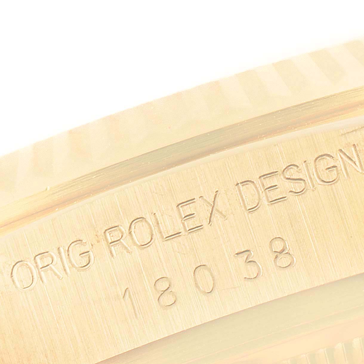 This close-up image of a Rolex President 18038 Men's Yellow Gold Champagne Dial 18038 Men's Yellow Gold Champagne Dial watch shows the engraved model number "18038" on the side of the case.