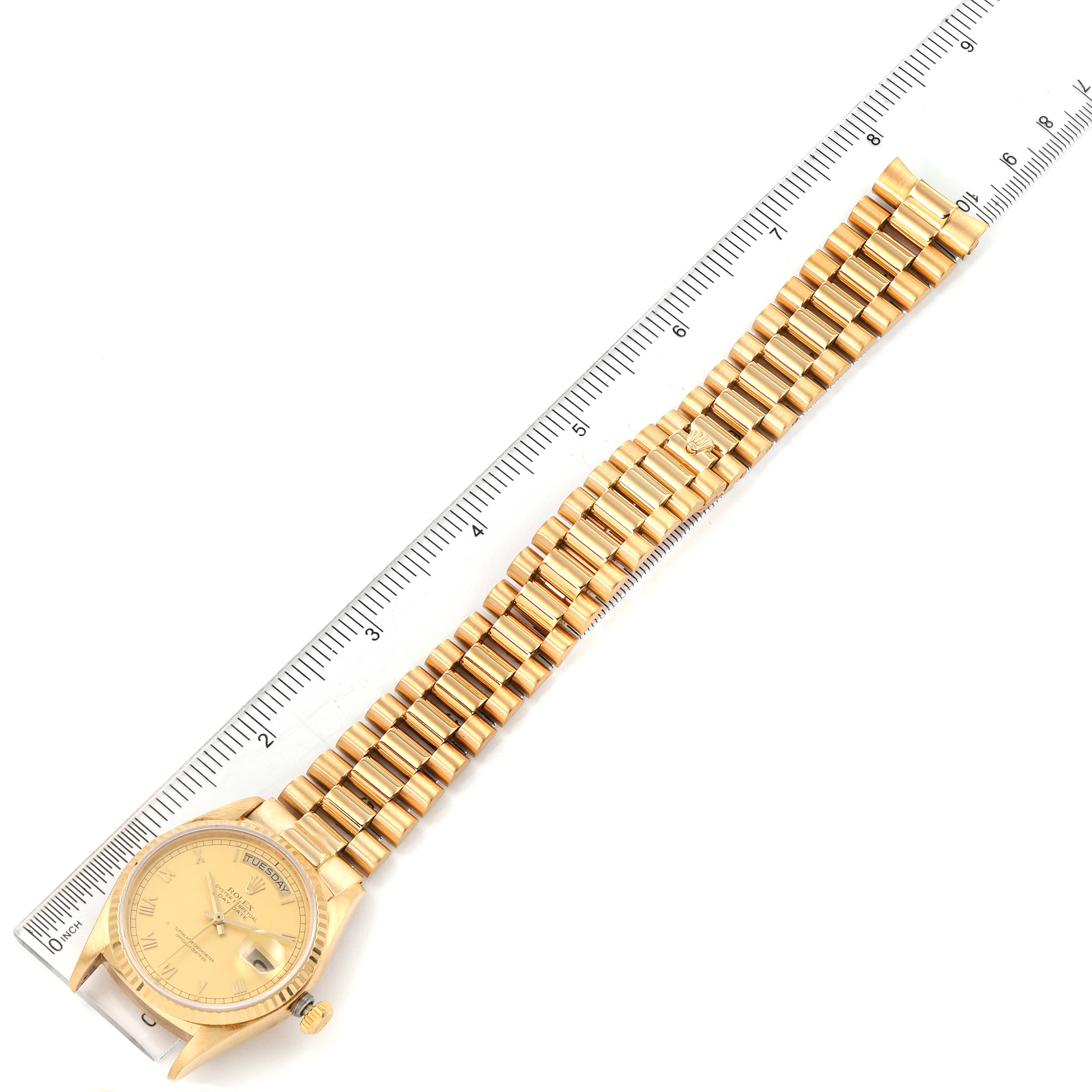 The image shows a Rolex President 18038 Men's Yellow Gold Champagne Dial 18038 Men's Yellow Gold Champagne Dial model watch laid flat next to a ruler, displaying its full length and bracelet.