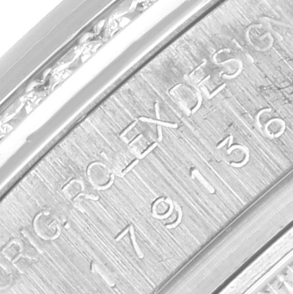 The image shows a close-up of the inner band engraving on a Rolex President 179136 Women's Platinum Blue Dial 179136 Women's Platinum Blue Dial watch, highlighting the serial number and branding.